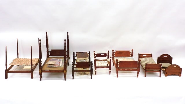 Doll Furniture and Accessories: 19th C. (22) pieces to include: (A) Eight beds: early 19th C. Federal poster bed with spiral turned posts; pencil post bed; sleigh beds; cannon ball beds; canopy beds and a Victorian bed. Beds measure