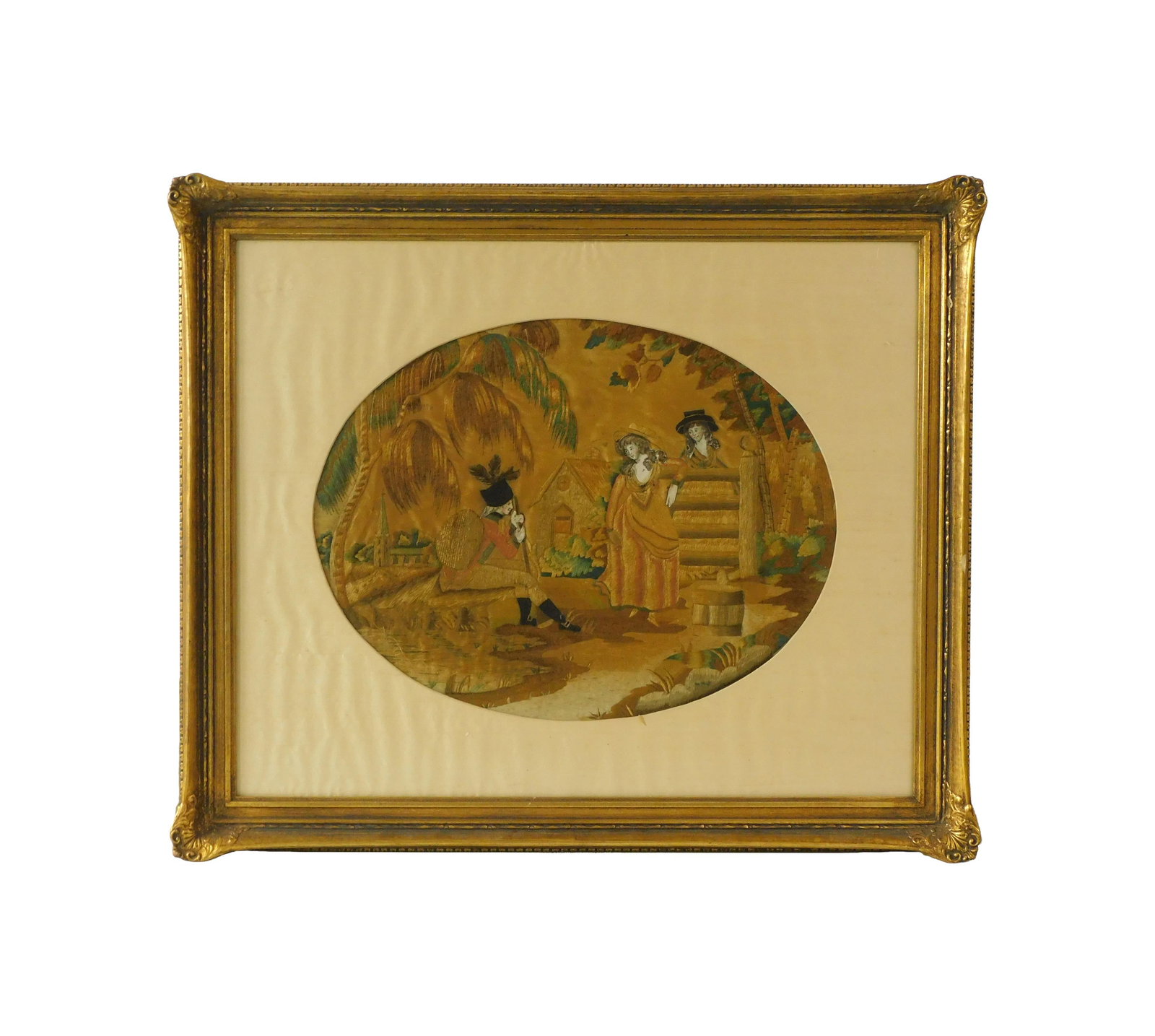 Silkwork Picture: Late 18th C. Depicts a British soldier with musket and red coat chatting with two young women in a rural landscape. 14" high x 18" wide. In a modern gilded frame under glass with cloth liner