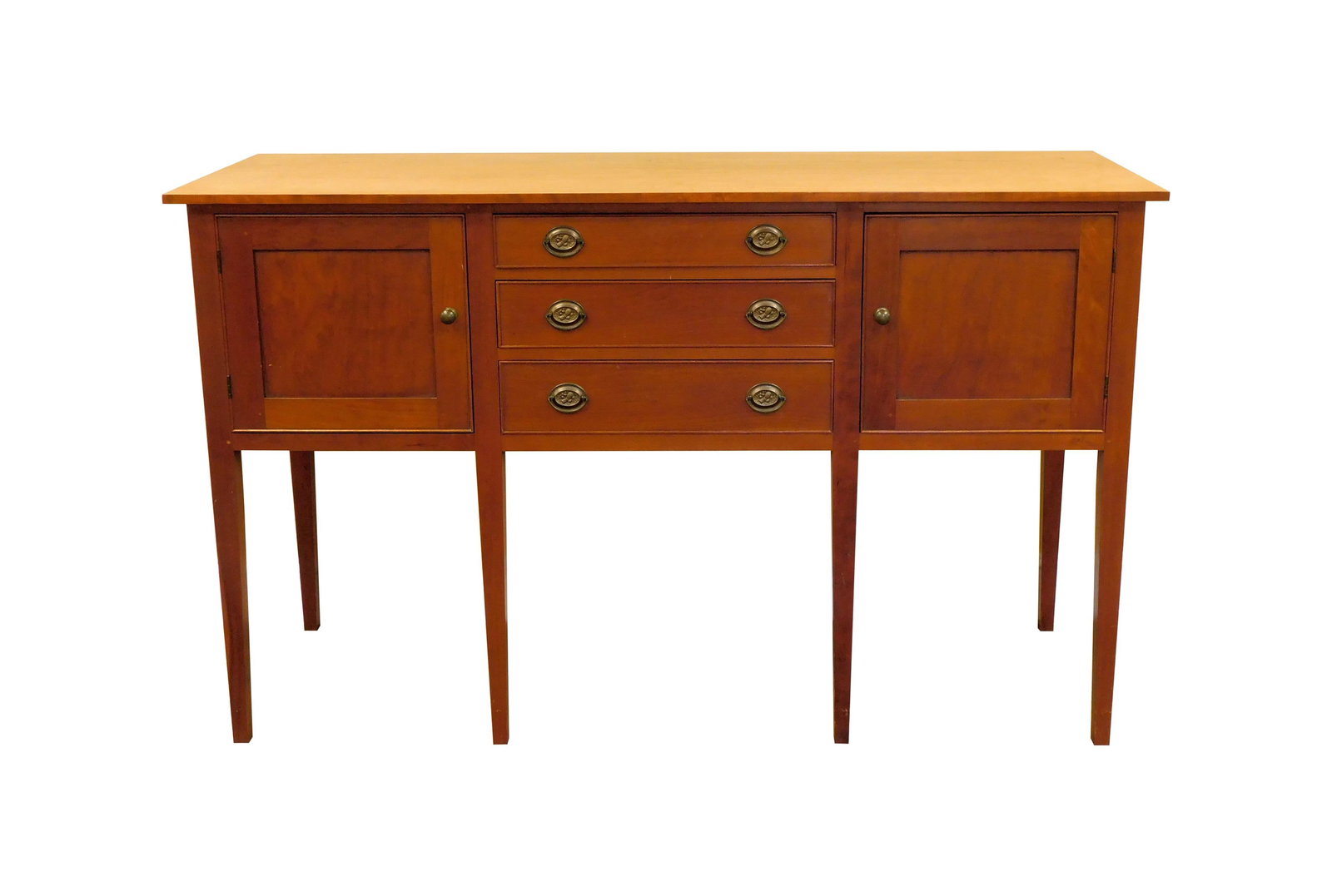 Eldred Wheeler Sideboard: Late 20th C. Solid cherry. Federal style. Three drawers flanked by two doors. Brass sheaf of wheat hardware. 39" high x 64" wide x 21 1/2" deep. Signed with a paper label on interior of top drawer. Go