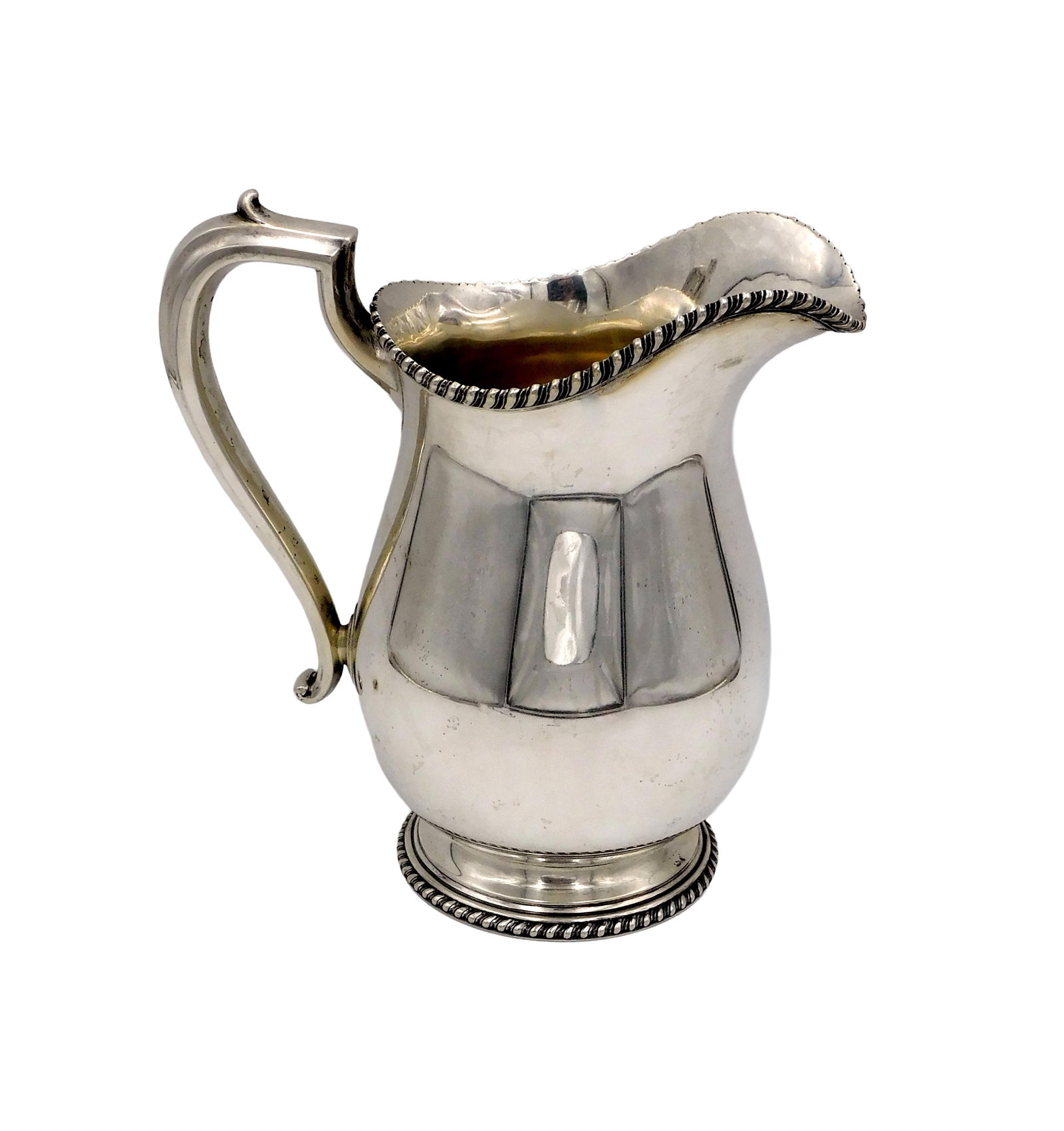 Sterling Silver Water Pitcher: Ca. 1960. Black, Star & Frost, Gorham. Ropework trim. 9 1/2" high x 9" wide. 27.57 ozt. No monogram. Please note this lot must be paid for by cash, wire transfer or known check. Items will be shipped