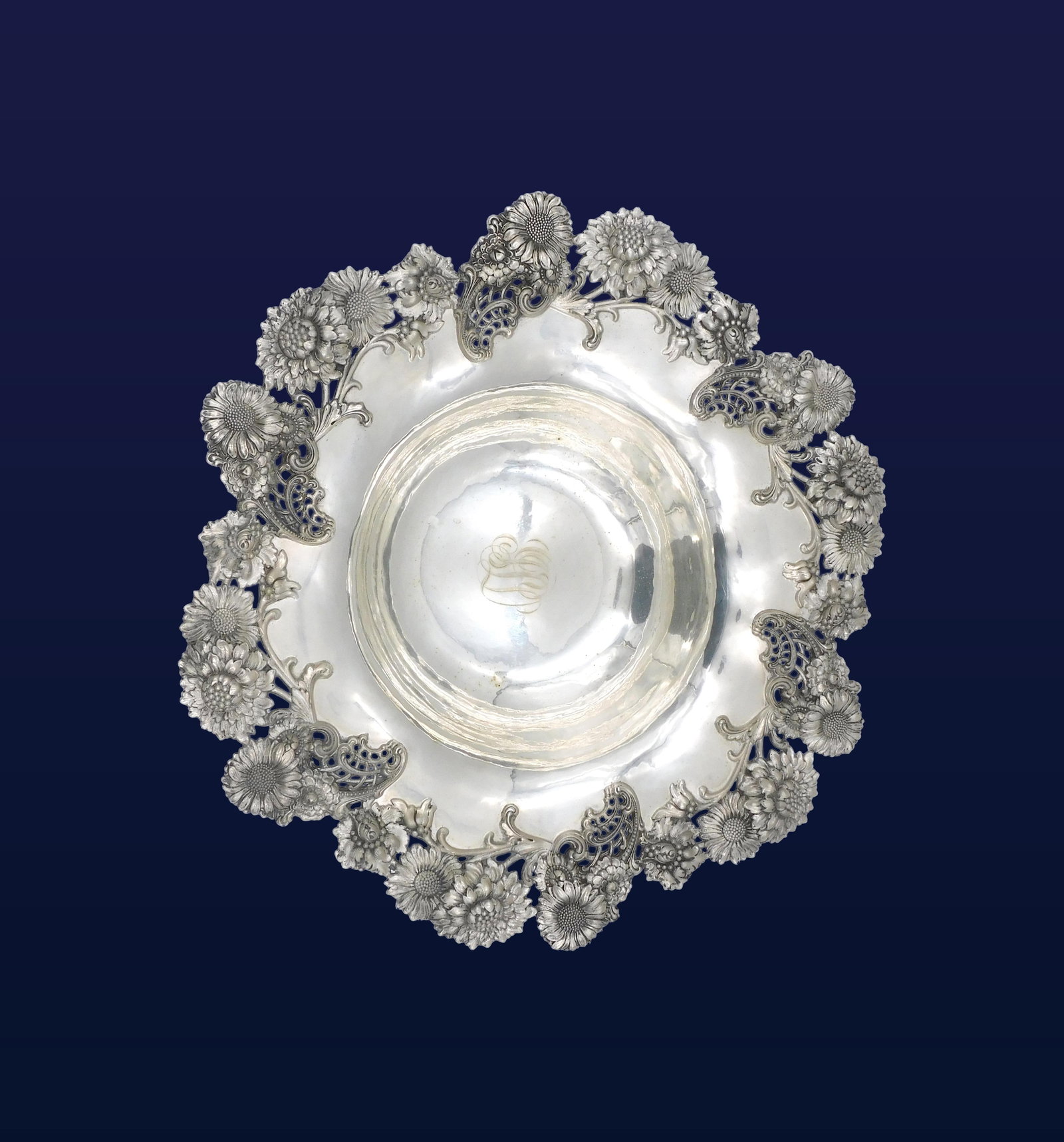 Large Ornate Sterling Silver Bowl: 19th C. Shreve Crump & Low. Dated October 20th, 1898. Ornate embossed floral border. 3 1/2" high x 14 3/4" diameter. 34.5 ozt.Monogrammed. Please note this lot must be paid for by cash, wire transfer