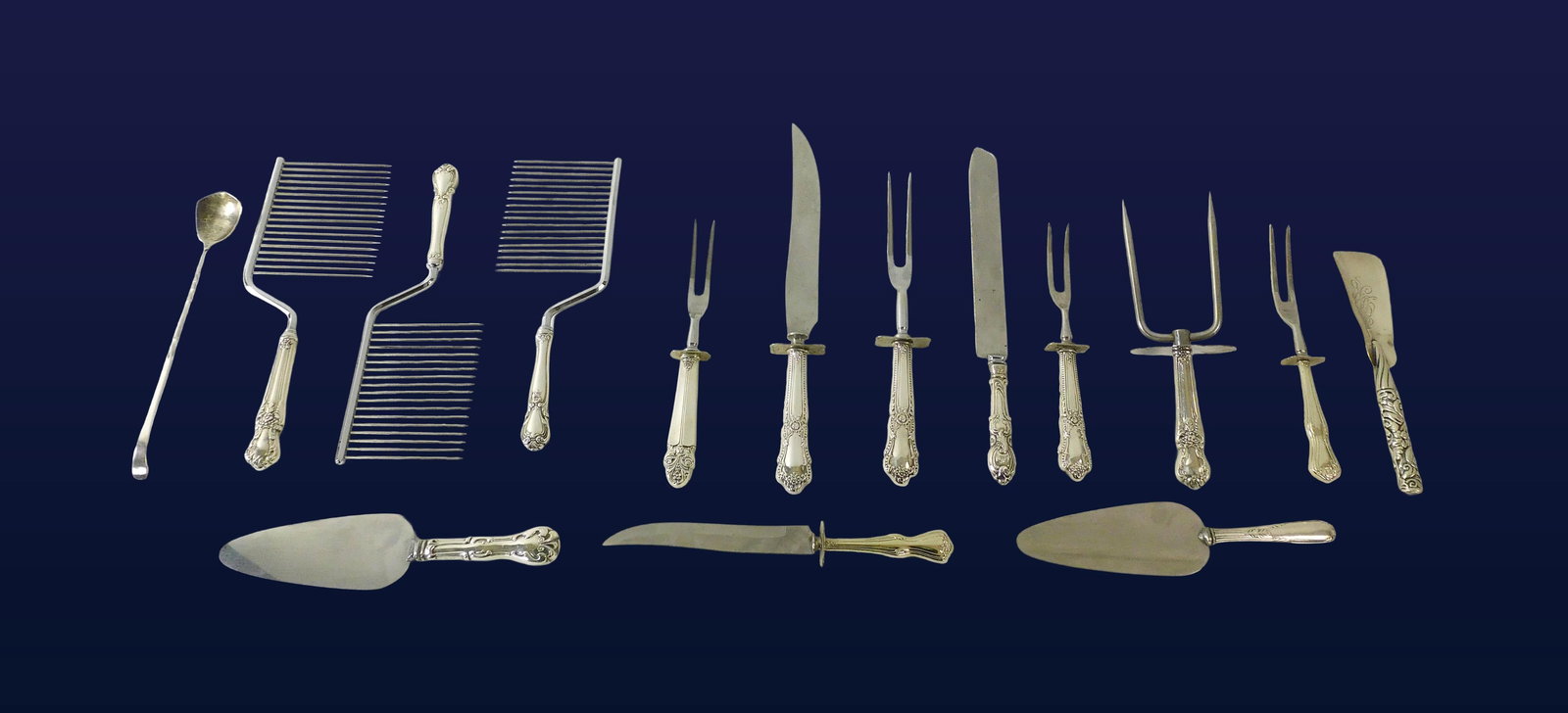 (15) Silver Serving Pieces: 20th C. To include: (A) Cake server. 9 1/4" long. (B) Cake server with serrated edge. 9 3/4" long. (C) Three cake combs. Ranging in length from 10 1/4"-10 3/4" long. (D) Carving knife and fork set. Fo