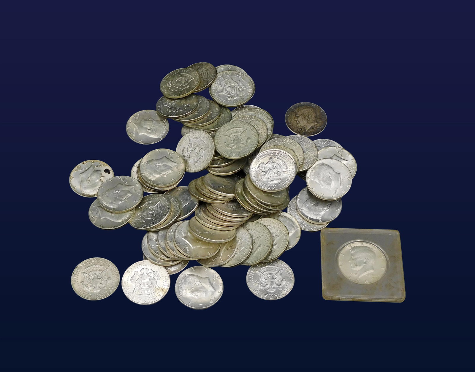 Approximately (85) Kennedy Half Dollars: To include: (A) Thirty-two 1964 issue. (B) Fifty-three 1965-1969 issue.(A) Many in BU condition. (B) Mixed condition from excellent to AU. Please note this lot must be paid for by cash, wire transfer