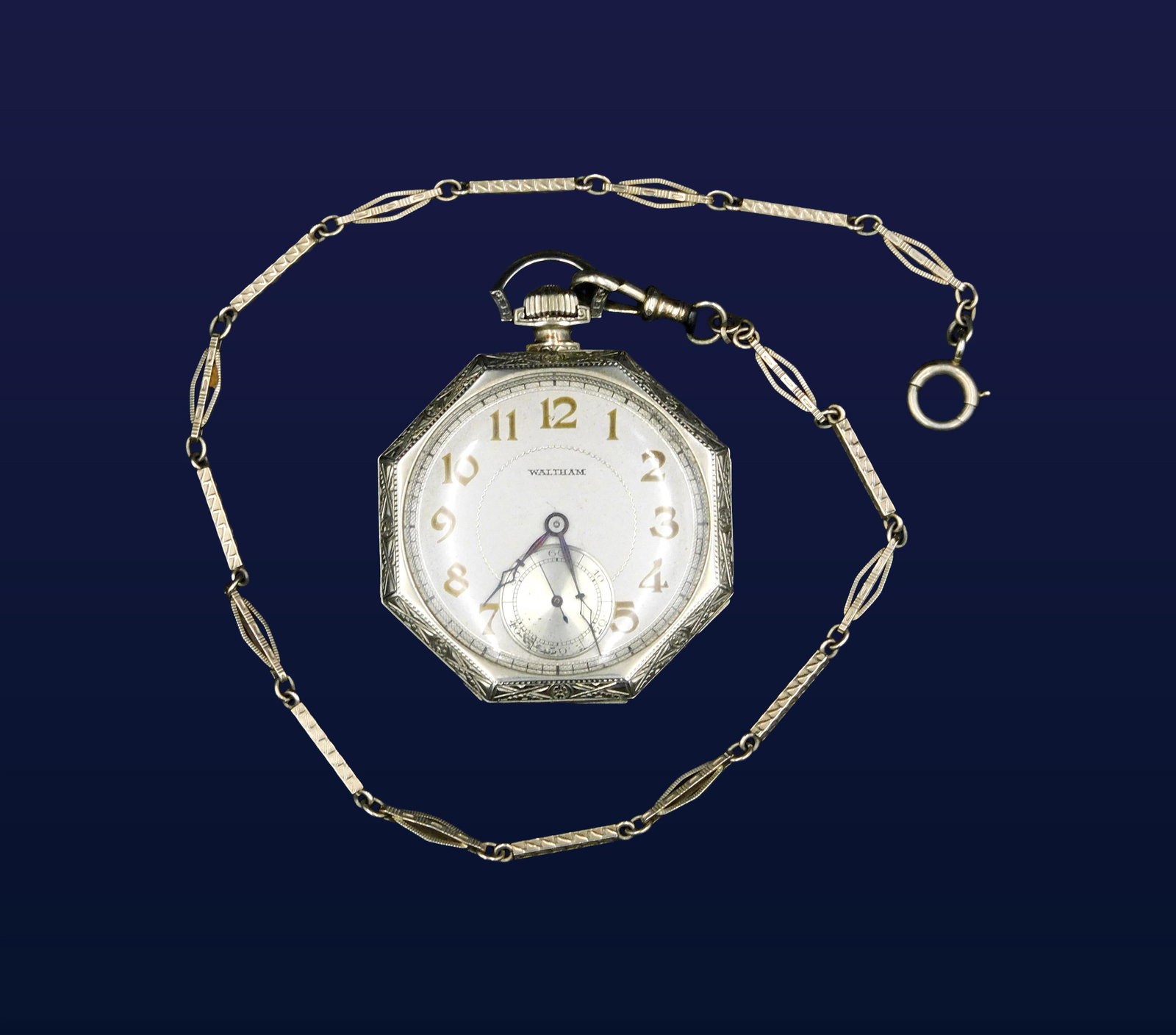 Waltham Art Deco Pocket Watch: 20th C. 14kt gold. 17 jewels. Octagonal case. Chain and back cover weigh 10 dwt. 1 3/4" wide. Currently working but not guaranteed. Please note this lot must be paid for by cash, wire transfer or know