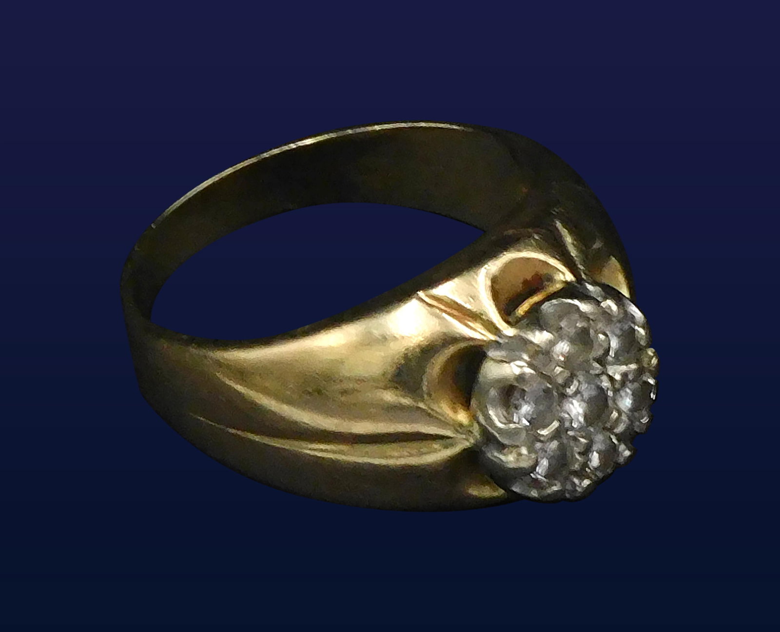 14kt Yellow Gold Ring: Size 7. Set with seven small, old European cut diamonds. 4.30 dwt. Please note this lot must be paid for by cash, wire transfer or known check. Items will be shipped or sent to shipper once payment cl