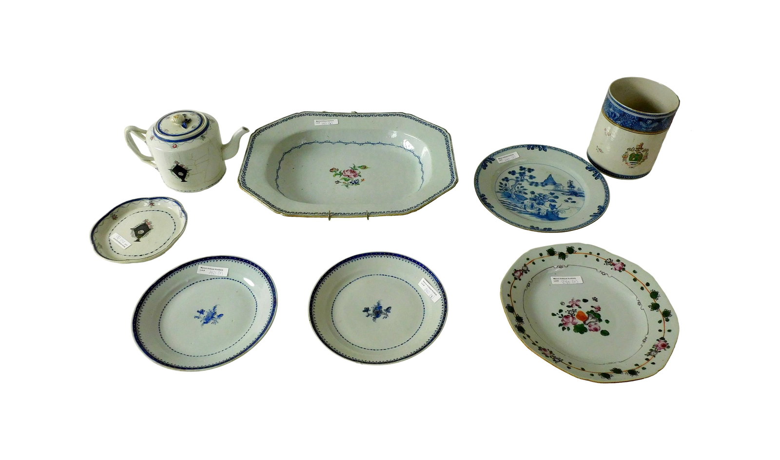 (7) Pieces Chinese Export Porcelain: 19th C. To include: (A) Shallow octagonal bowl. 3" high x 14 1/2" wide x 11" deep. (B) Strap handled mug with heraldic crest with lions. 6" high x 7" wide. (C) Strap handled teapot. 5" high x 8 1/2" w