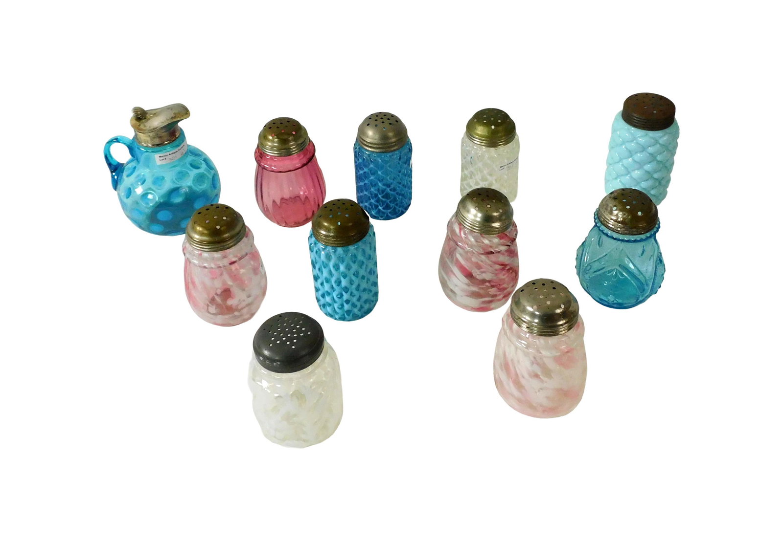 (10) Sugar Shakers and (1) Syrup Pitcher: 19th/Early 20th C. To include: (A) Three End of the Day shakers. 5" high. (B) Opalescent Daisy and Fern shaker. 4 1/4" high. (C) Three opalescent shakers. 5" high. (D) Tufted blue milk glass