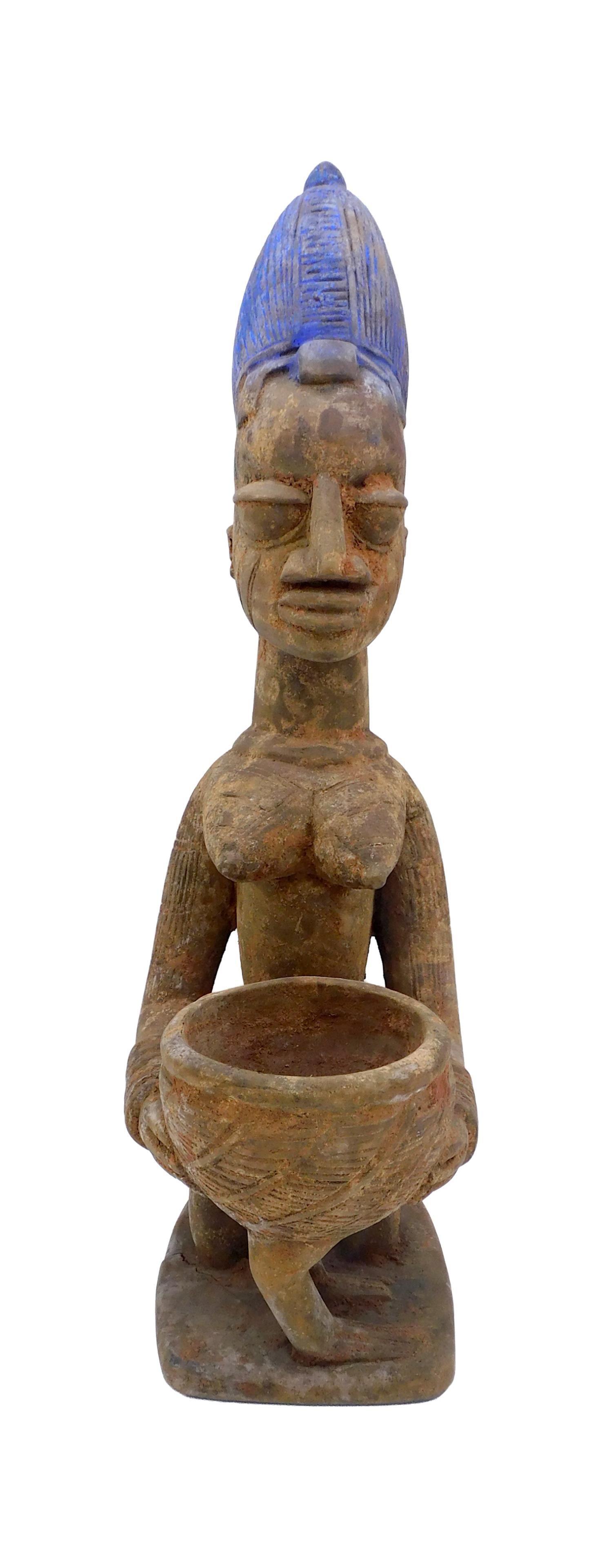 African Yoruba Divination Bowl: Probably 19th C. Carved wood. Polychrome painted hat. 20" high x 5" wide x 7" deep. Provenance: from the Richard Kempshall Meyer Collection. Old worn finish. Base shows age separation crack. IMPORTANT