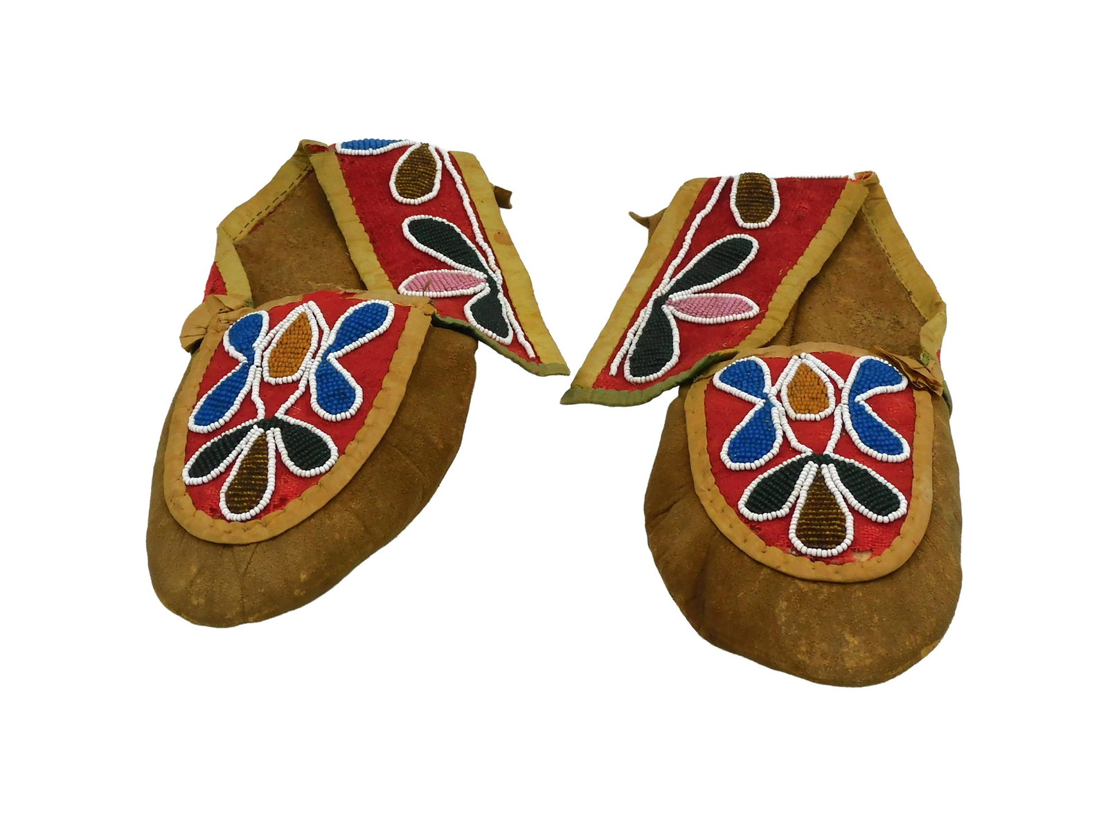 Pair of Great Lakes Woodlands Moccasins: 19th C. Deerskin with beadwork. 9 3/4" long.Shows wear consistent with age and use. IMPORTANT- Please note: all items are sold as is, where is, with all faults. Marion Antique Auctions encourages all
