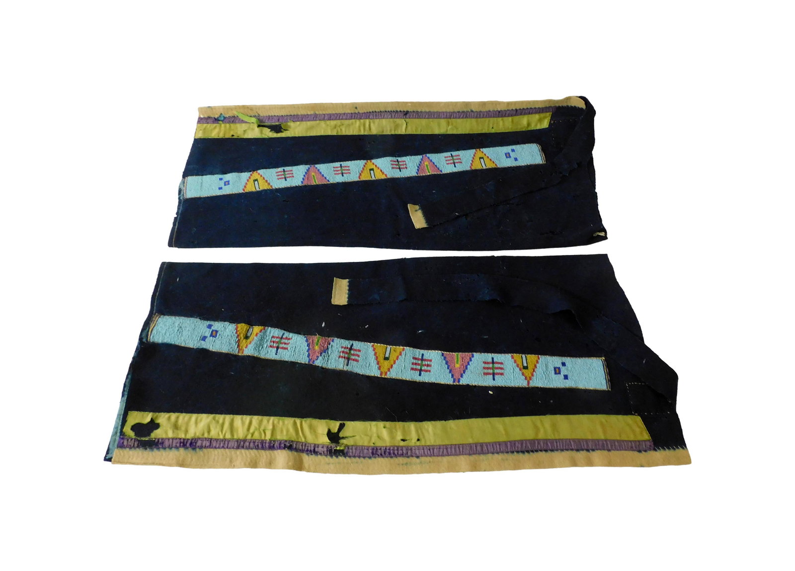 Nez Perce Men's Wool Leggings: 19th C. Beaded strips. 30 1/2" long. Fabric shows damage and excessive wear. Beaded strips are in good condition. IMPORTANT- Please note: all items are sold as is, where is, with all faults. Marion