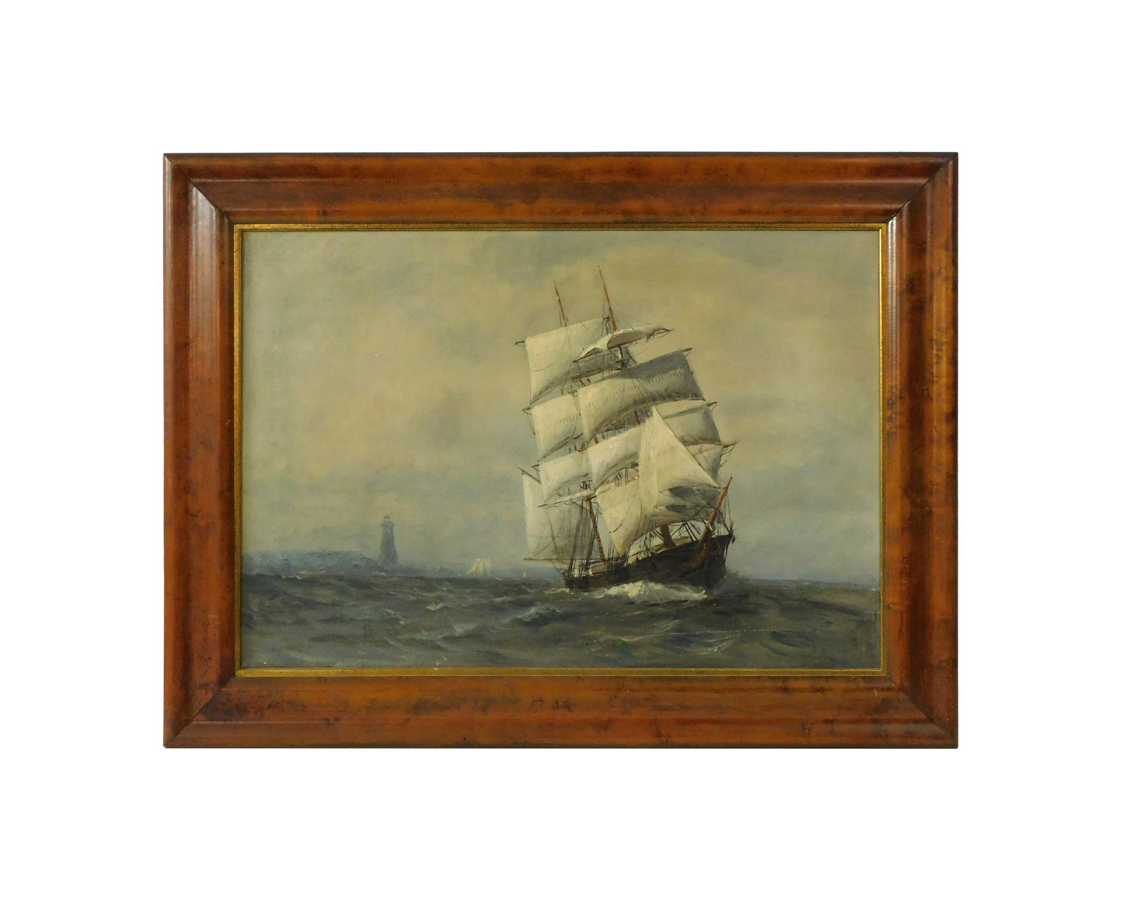 T. Bailey Maritime Painting: Early 20th C. Oil on canvas. Depicts a three-masted square-rigged vessel under sail in choppy seas with lighthouse in the distance. Signed lower right. Sight size: 17 7/8" high x 25 7/8" wide. In a mo