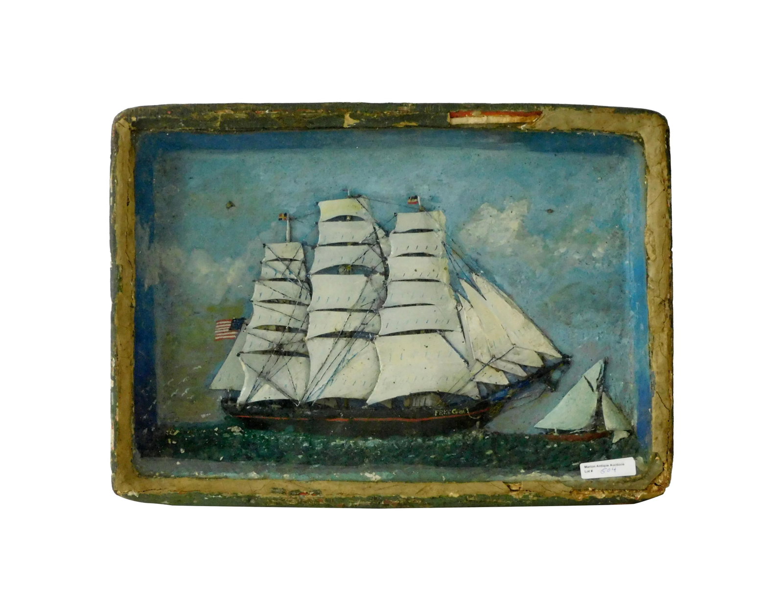 Ship Model Shadowbox Diorama: 19th C. Featuring the ship THE FREE CUBA. 13 1/2" high x 18 1/2" wide x 3" deep. The sails have been repainted. Frame shows damage and loss. IMPORTANT- Please note: all items are sold as is, where