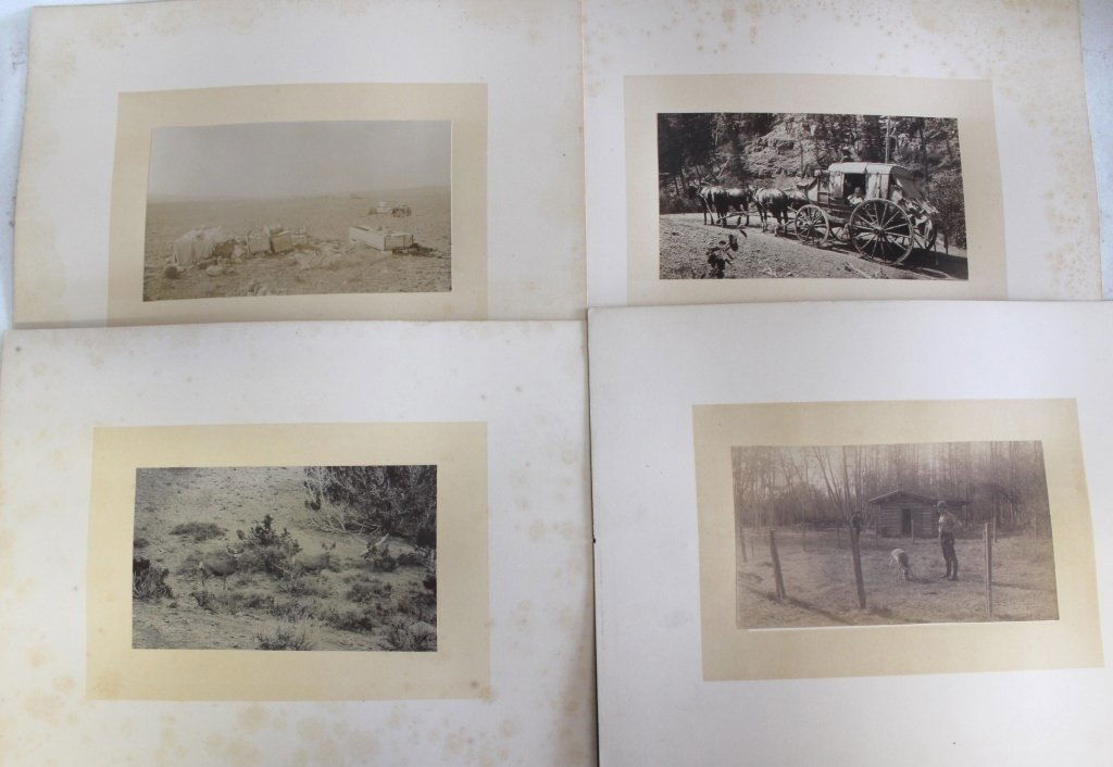 FOUR LATE 19TH C MOUNTED PHOTOS: PROBABLY MONTANA; ONE SHOWING WOODEN CASKETS IN THE PRAIRIE FULL OF SKULLS AND BONES; ONE SHOWING STAGE COACH WITH WOMAN AND BABY; ONE SHOWING TWO DEER OR ELK; ONE SHOWING TWO SETTLERS NEAR A CABIN; F