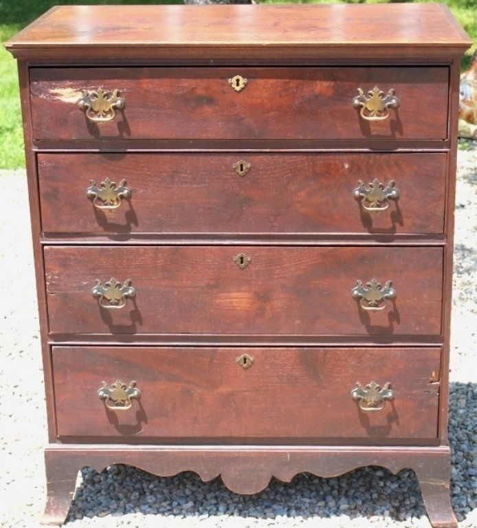 AMERICAN WALNUT CHIPPENDALE FOUR-DRAWER: CHEST, CA 1800; POSSIBLY SOUTHERN STATES; SECONDARY WOOD IS PINE, POPLAR AND CHESTNUT; ORIGINAL FINISH WITH MINOR REPAIRS TO FRONT FEET; REPLACED HARDWARE; 43" HIGH; 35" WIDE; 22" DEEP.