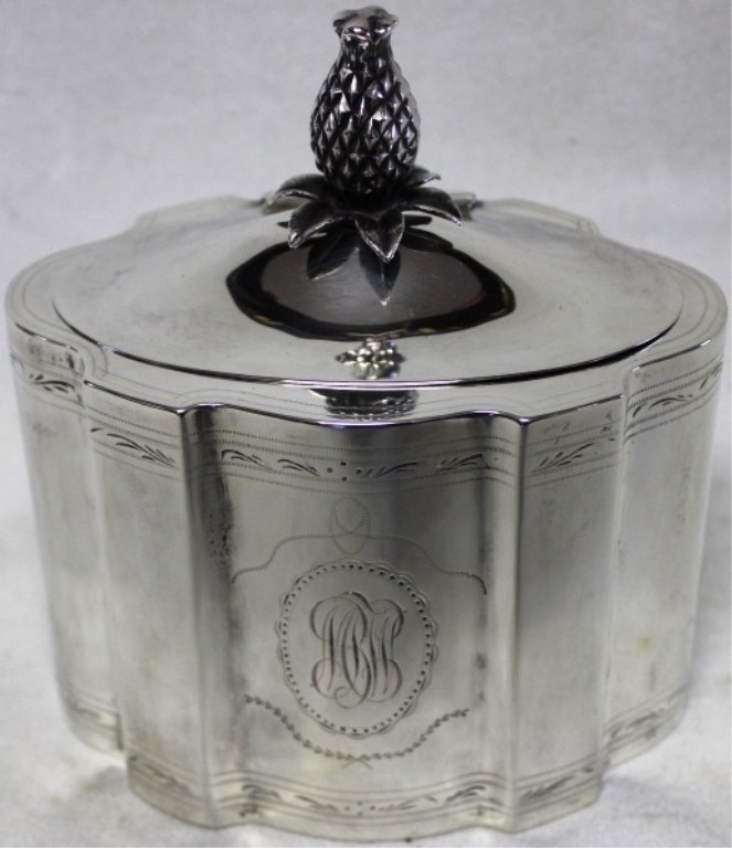 STERLING SILVER TEA CADDY, CA 1920 - 1920,: CHASED DESIGN; PINEAPPLE FINIAL; MONOGRAM ON FRONT; 5 1/2" HIGH INCLUDING FINIAL; 5" WIDE; 3 1/2" DEEP; 11.8 OZT.