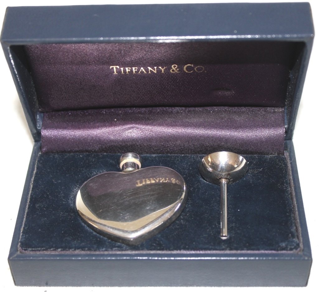 TIFFANY & CO. STERLING SILVER HEART SHAPED: PERFUME BOTTLE WITH FUNNEL IN FITTED TIFFANY BOX.