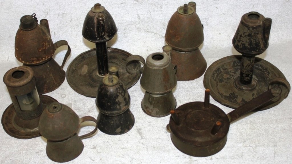 COLLECTION OF NINE PIECES OF 19TH C TIN LIGHTING: TO INCLUDE PETTICOAT LANTERNS, ETC. SOME WITH ORIGINAL BURNERS; 2 3/4" TO 6 1/2" HIGH; VARIOUS WORN FINISH.