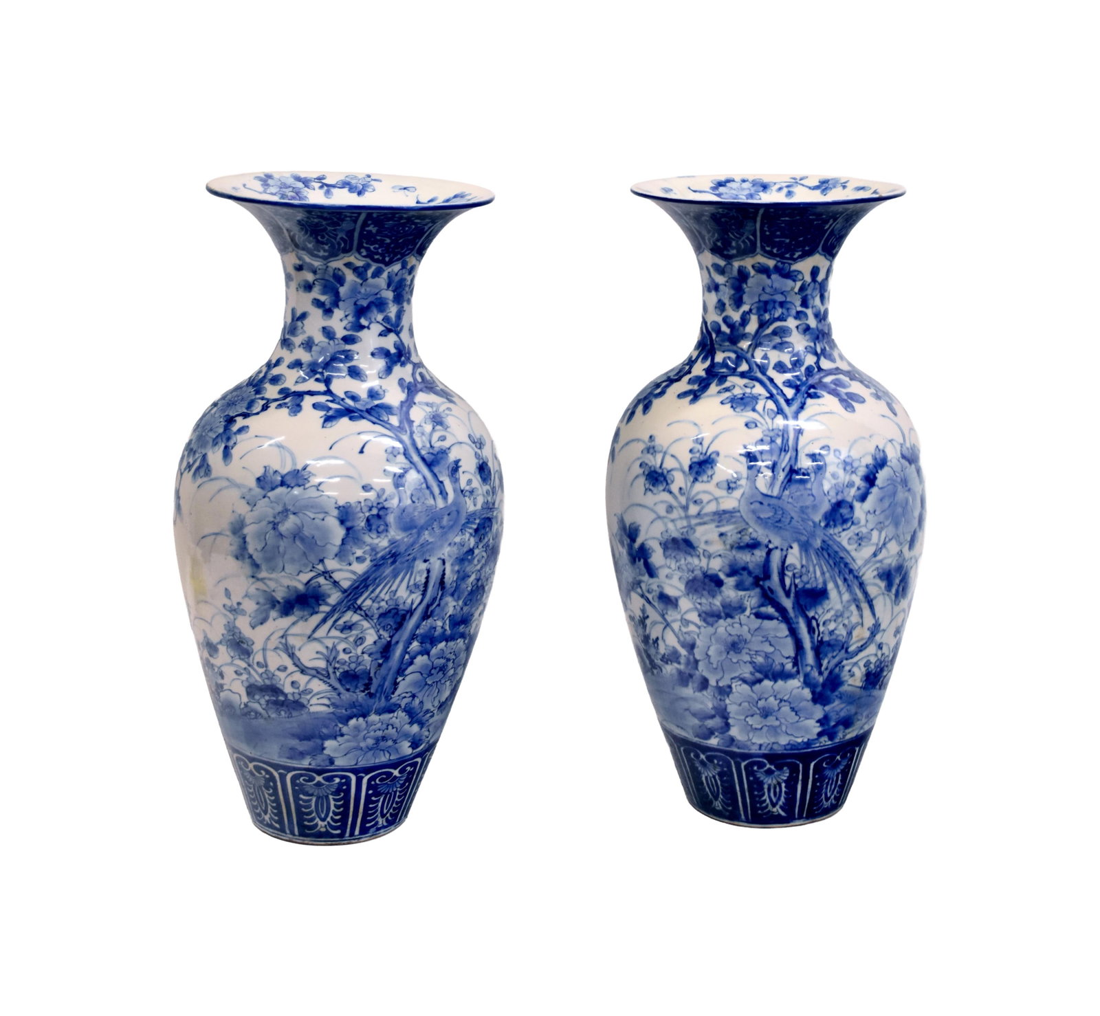 Pair of Large Japanese Vases: 19th C. Meiji period. Blue and white porcelain vases with floral with peacock decoration. 24" high x 11" diameter. 21 lbs. each. One shows 4 1/2" hairline crack. Same vase also shows a spider crack