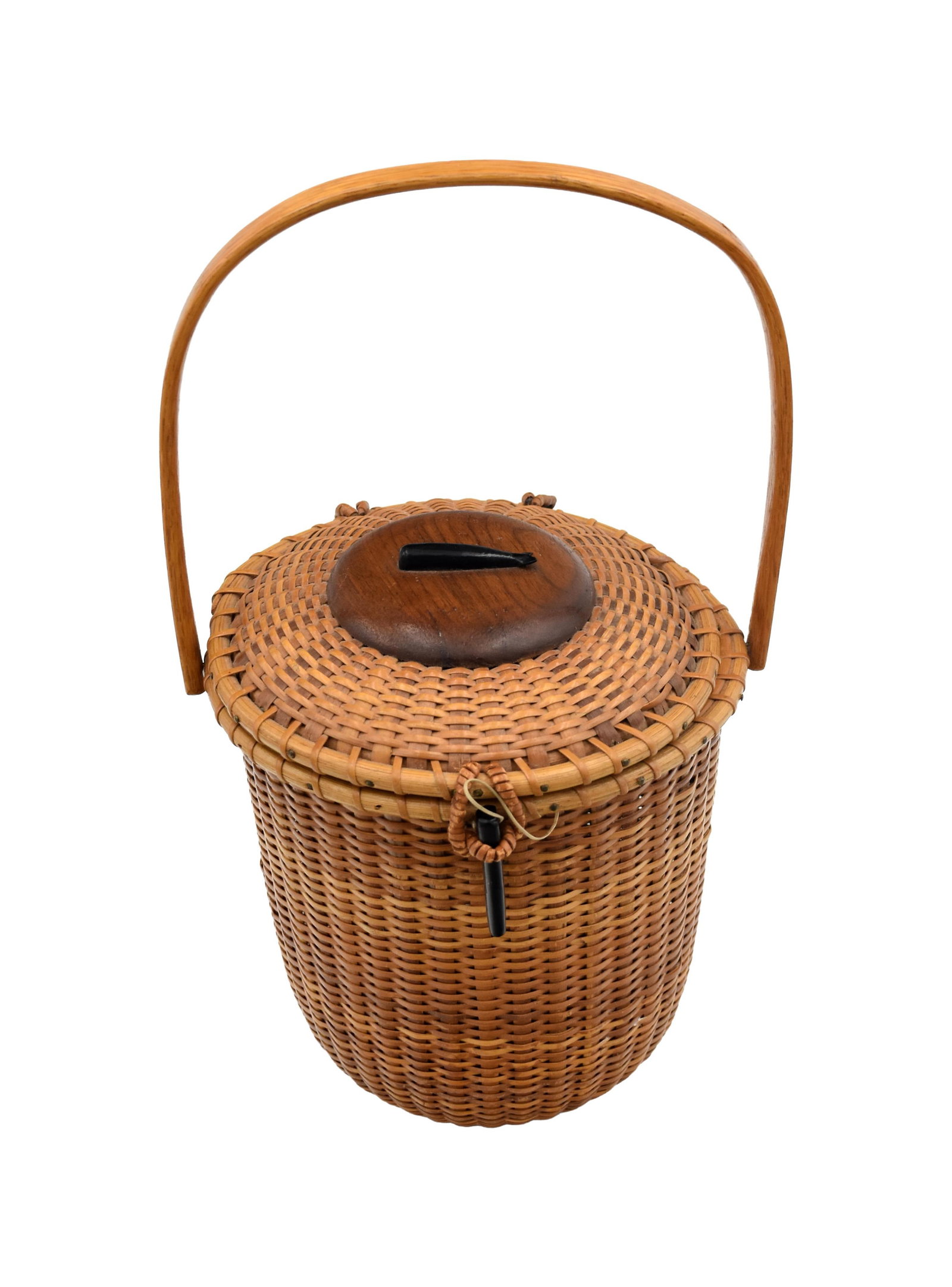 John Kittila, Jr. Nantucket Friendship Purse: (American, 1918-1984). Tall form. Round with swing handles. Ebony whale on lid. Ebony pin clasp. 13 3/4" high x 7" diameter. Good original condition. IMPORTANT- Please note: all items are sold as is,