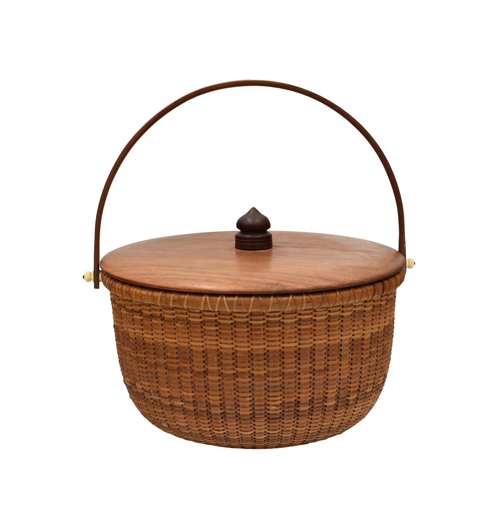 Bill Sevrens Nantucket Lightship Basket: (American, 1916-2001). Ca. 1975. Round form swing handle. Unusual fitted mahogany cover with an ebony finial. Signed on inside bottom with penny and date. 15" high x 12 1/2" diameter.Good original
