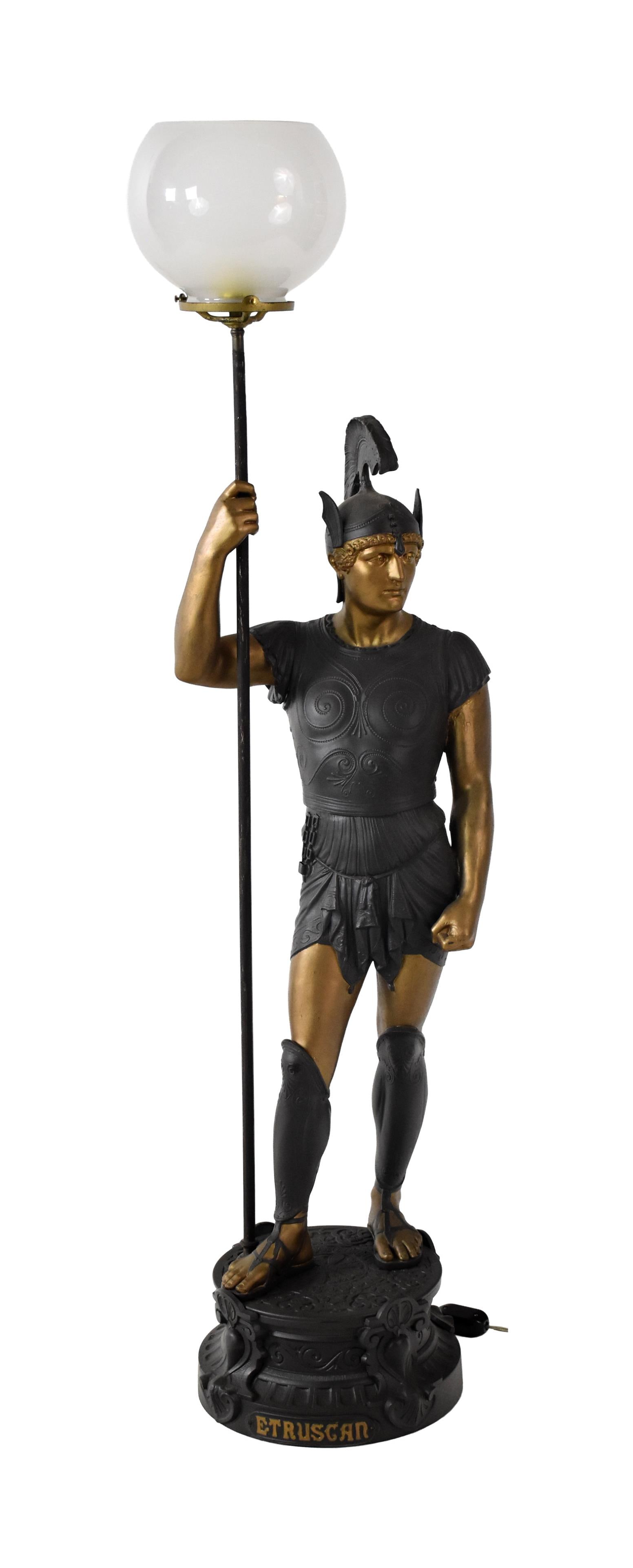 Figural Etruscan Warrior Newel Post Gas Lamp: Ca. 1869-1889. Cast white metal. Frosted glass shade. 50" high. 38.4 lbs.Old finish. Glass shade shows chip to rim. Electrified. IMPORTANT- Please note: all items are sold as is, where is, with all