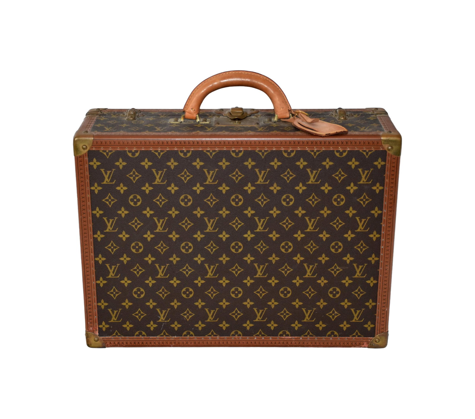 Louis Vuitton Suitcase: Mid-20th C. Serial #984515. Paris label. Interior straps intact. Signed brass hardware. Includes original key. 7" high x 19 1/2" wide x 14 1/2" deep. Provenance: Rainey family, New York City and