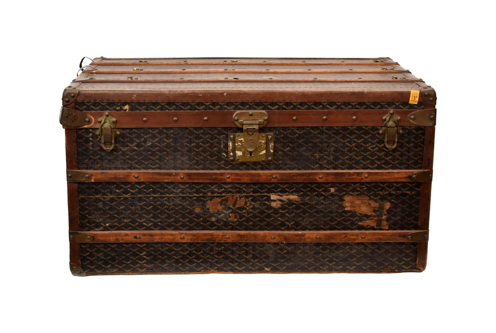 Goyard Steamer Trunk: Late 19th/Early 20th C. Brass trim and hardware. Two lift out fitted interior compartments. Leather handles. Signed "Goyard, Aine, Deposse" on lock. 20" high x 33" wide x 19" deep.Remnants of old