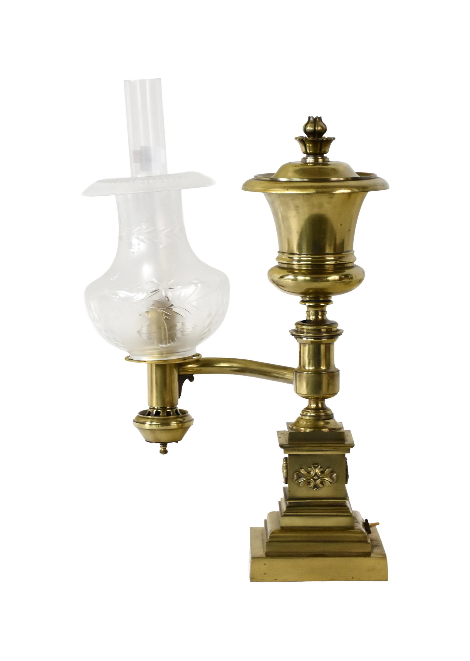 Brass Single Arm Argand Lamp: 19th C. Classical design with stepped column base. Cut glass shade. 17" high; 18 1/2" high with chimney x 10" wide. 5" diameter of shade. 11.8 lbs. with shade. Provenance: Estate of Alfred J. Walker,