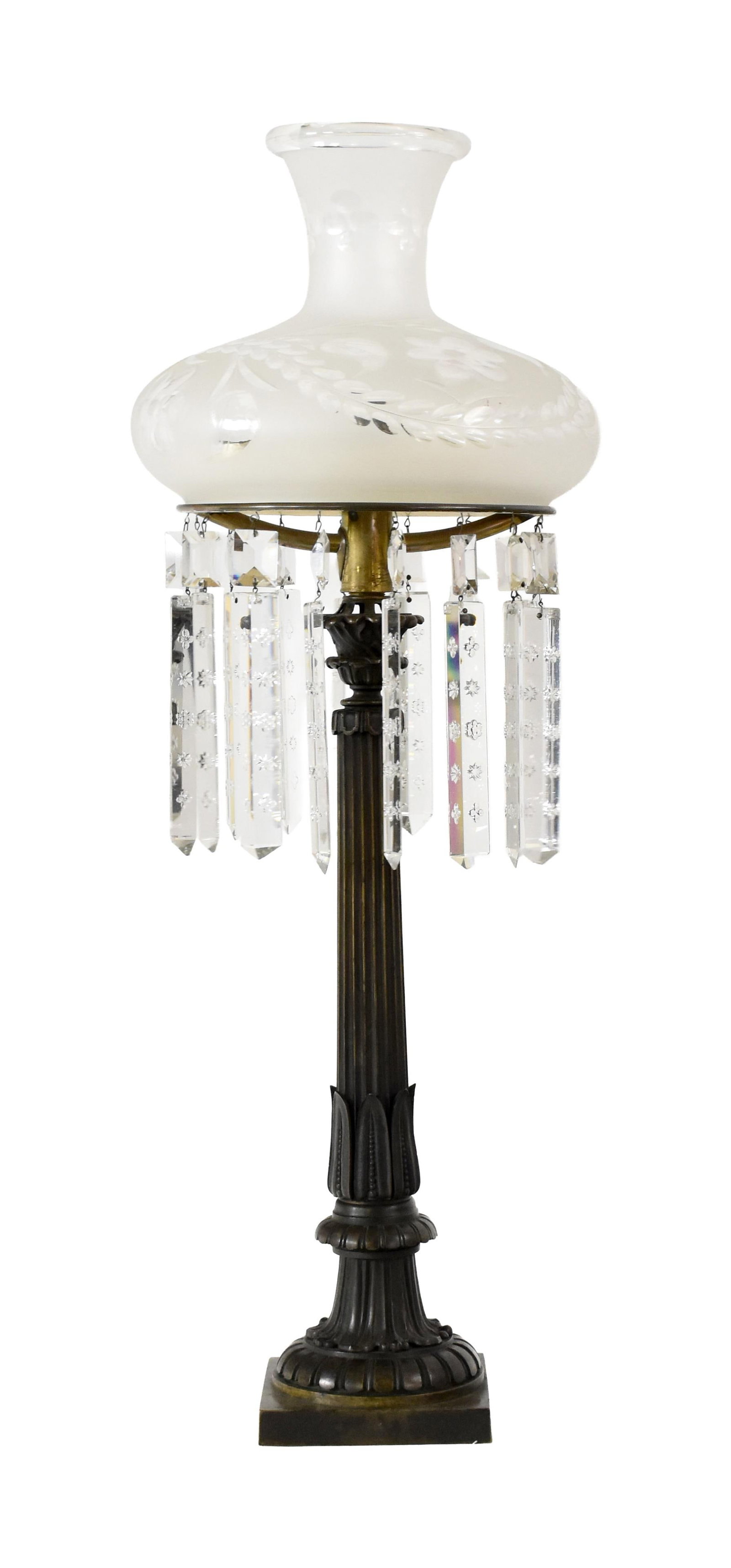 Bronze Sinumbra Lamp: 19th C. Fluted central column with petal design on base. Cut glass frosted shade. Cut glass prisms. 30" high x 11 1/2" diameter of shade. 14.8 lbs. Comes with extra burner tube and wicks. Provenance: