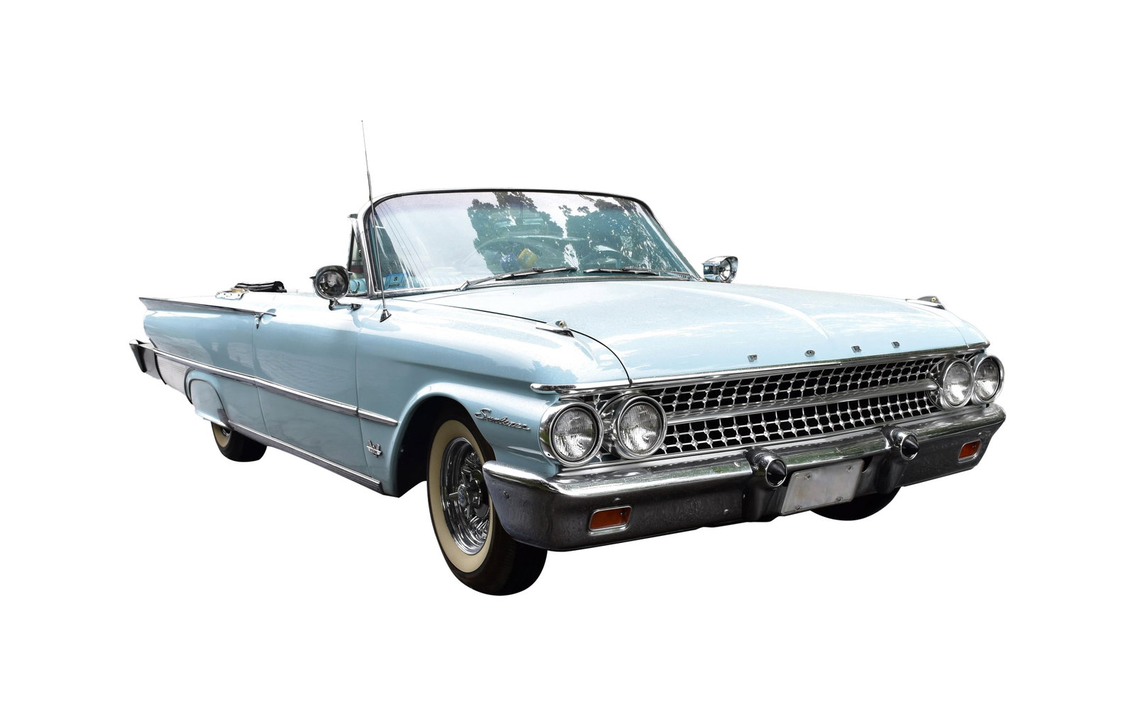 1961 Ford Sunliner Two-Door Convertible: Serial #1E55Z175362. Light blue exterior with vintage two-tone blue interior. Powered by a 390 Thunderbird V8 engine with standard transmission. Features include whitewall tires, continental kit,
