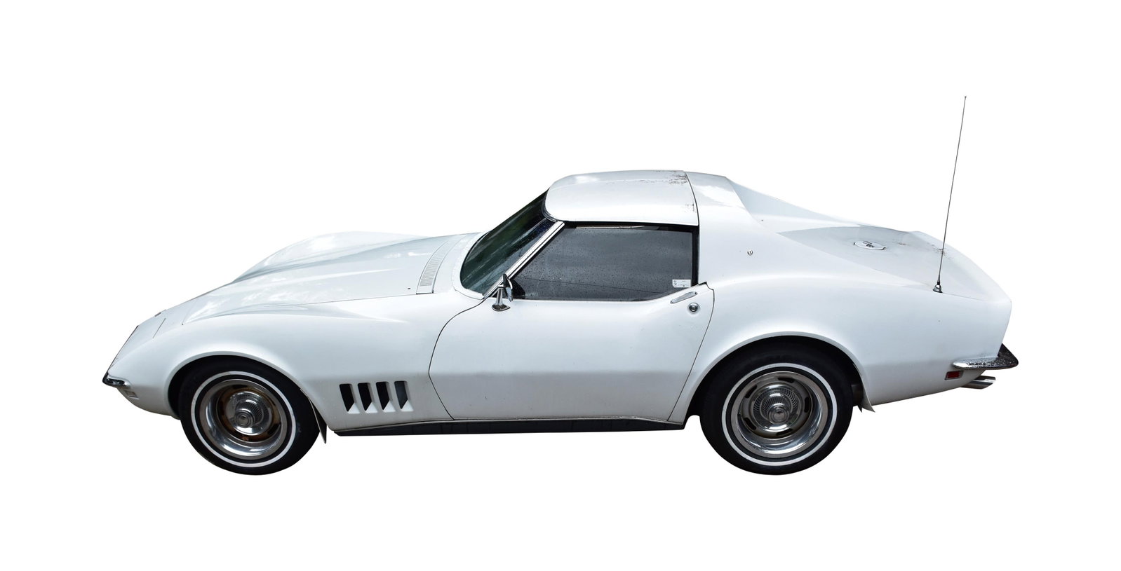 1968 Chevrolet Corvette T-Top Coupe: T-top coupe in white with black interior. Powered by a 350 V8 engine with automatic transmission. Features include cassette tape player, power windows, power brakes, air conditioning and dual