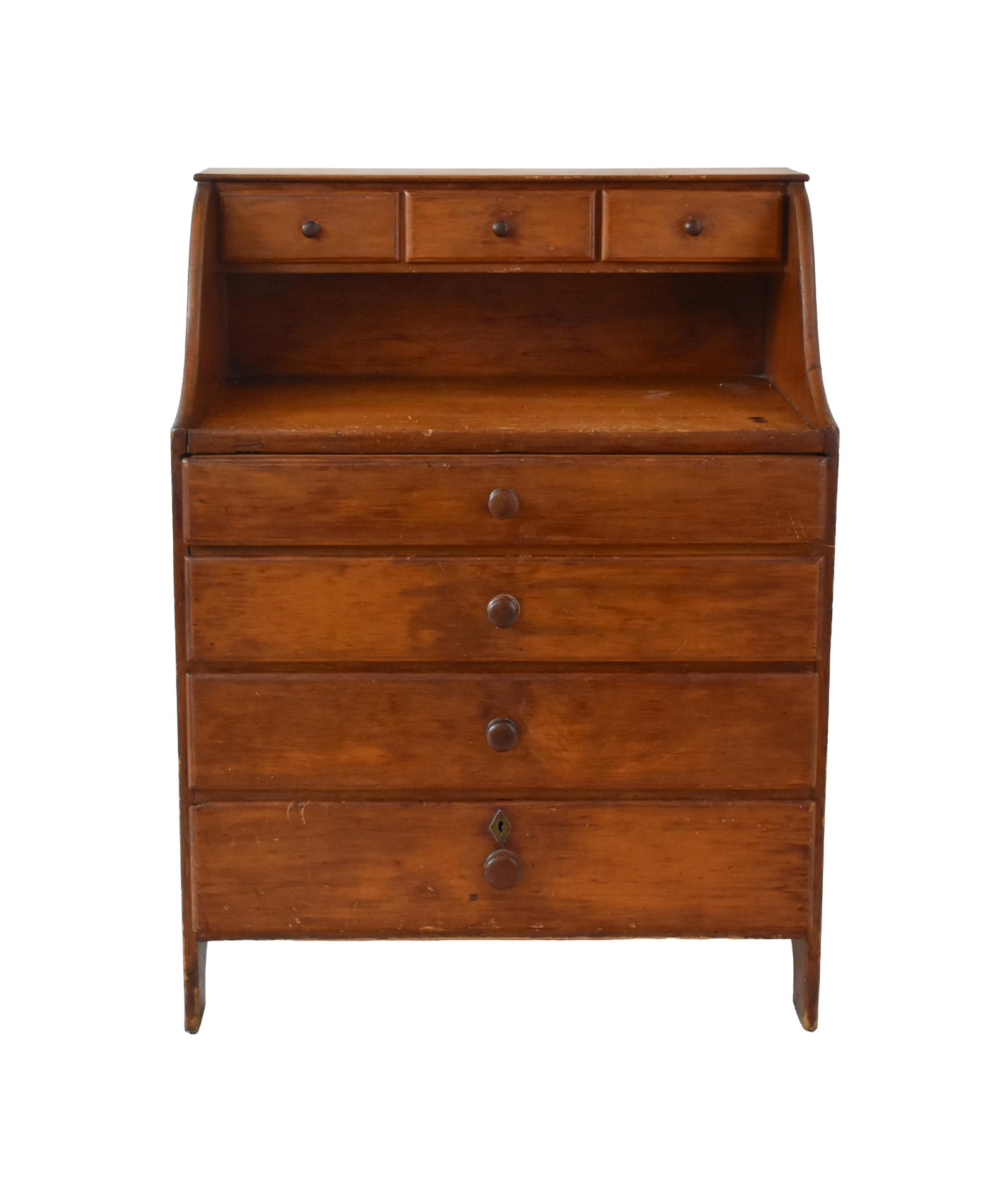 Shaker Sewing Desk: Early 19th C. Pine. Cutout ends. Three-drawer top over work surface. Four graduated drawers. Top drawer has lift top lid. 35 3/4" high x 27 1/2" wide x 18 1/2" deep. Provenance: From the collection