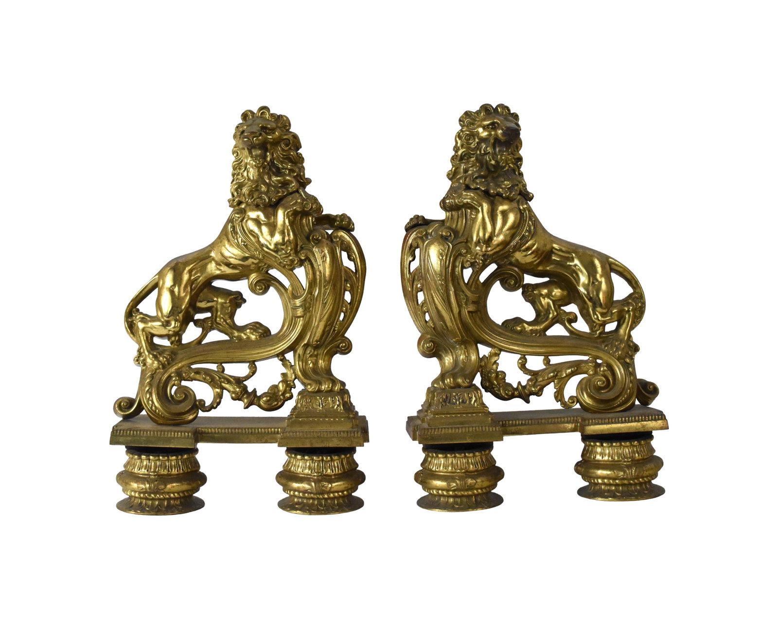 Pair of Brass Chenets, Heraldic Lions: 19th C. Rampant lion with shield on an ornate footed base. 24" high x 15 1/2" wide x 6" deep. Approximately 49 lbs. each.Good condition. Old finish. IMPORTANT- Please note: all items are sold as is,