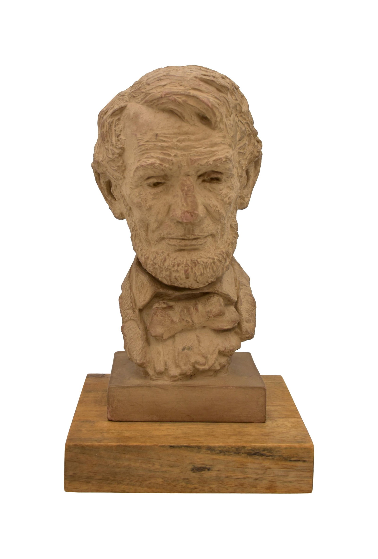 Jo Davidson Sculpture of Abraham Lincoln: (French/American/New York, 1883-1952). Clay on wood base. Signed and dated 1943. Sculpture: 10" high x 4 1/2" wide x 4" deep. Mounted on a wooden base: 11 1/2" high x 6 1/2" wide x 6 1/2" deep. 6.4