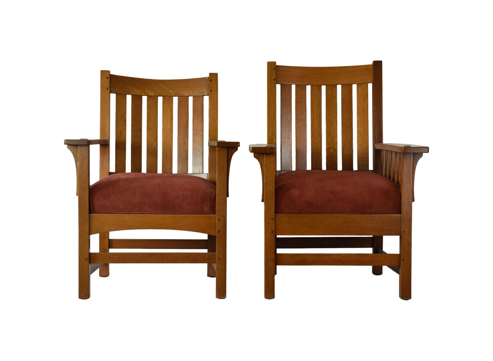 Pair of L. & J.G. Stickley Mission Oak Armchairs: Early 20th C. Mortise and tenon construction. Signed on back stretcher with decal label: "The work by L. & J.G. Stickley". Drop in spring unit cushions. 40" high x 28 1/2" wide x 25" deep. Seat height