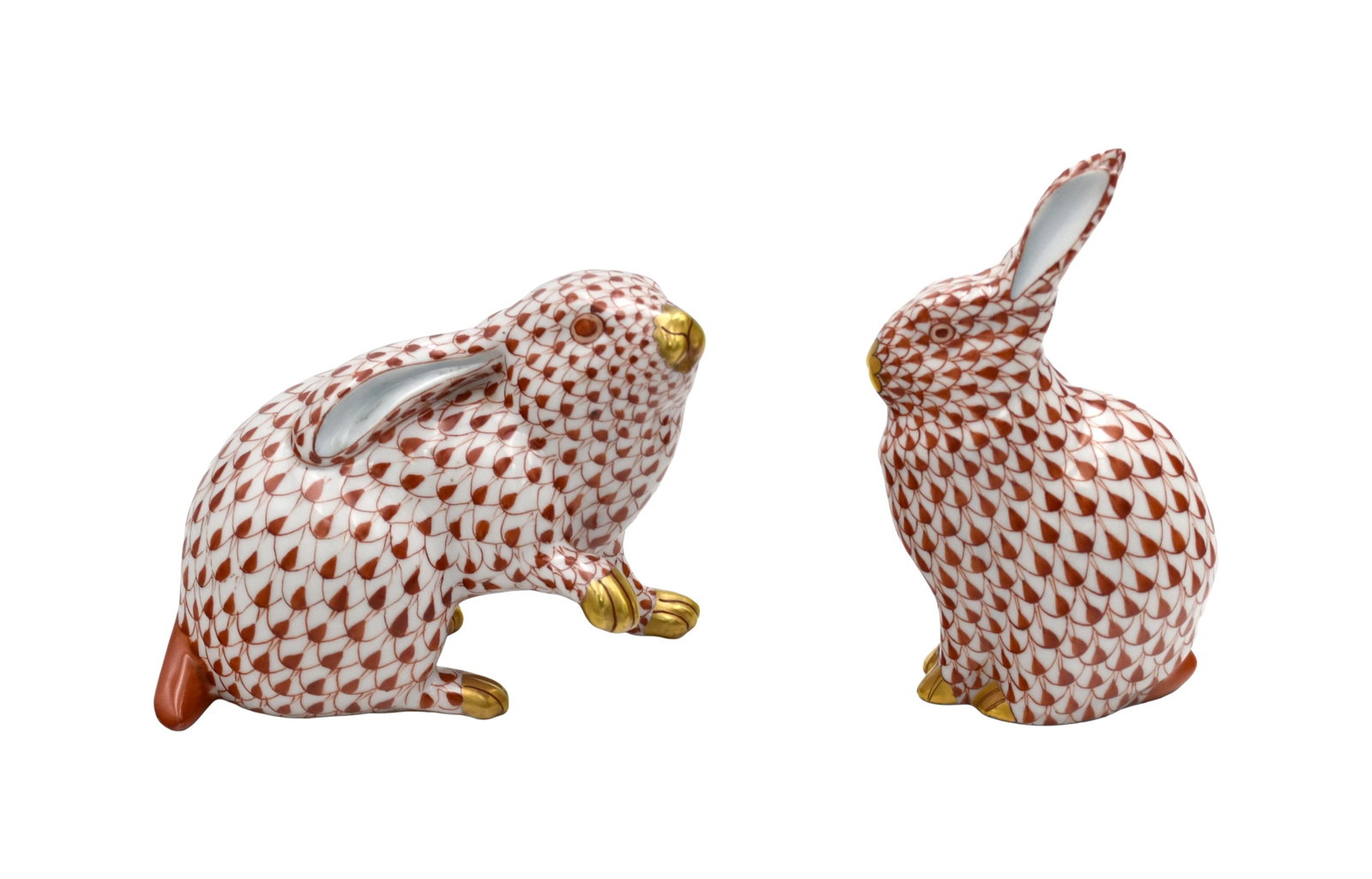Two Herend Porcelain Bunnies: 20th C. Rust color. To include: (A) 5 1/2" high x 3 1/4" wide. (B) 4 1/2" high x 5 1/4" wide.Good condition. No chips or cracks. IMPORTANT- Please note: all items are sold as is, where is, with all