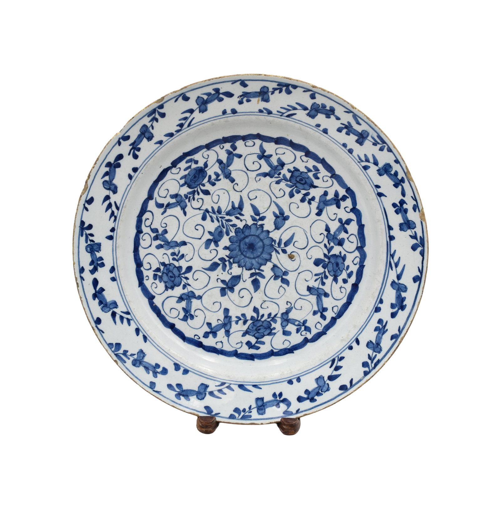Delft Charger: 18th C. Blue and white floral design. 2 1/2" high x 14" diameter. Provenance: Estate of Alfred J. Walker, legendary art dealer and collector. Founder of Walker-Cunningham Fine Art.Shows minor chips