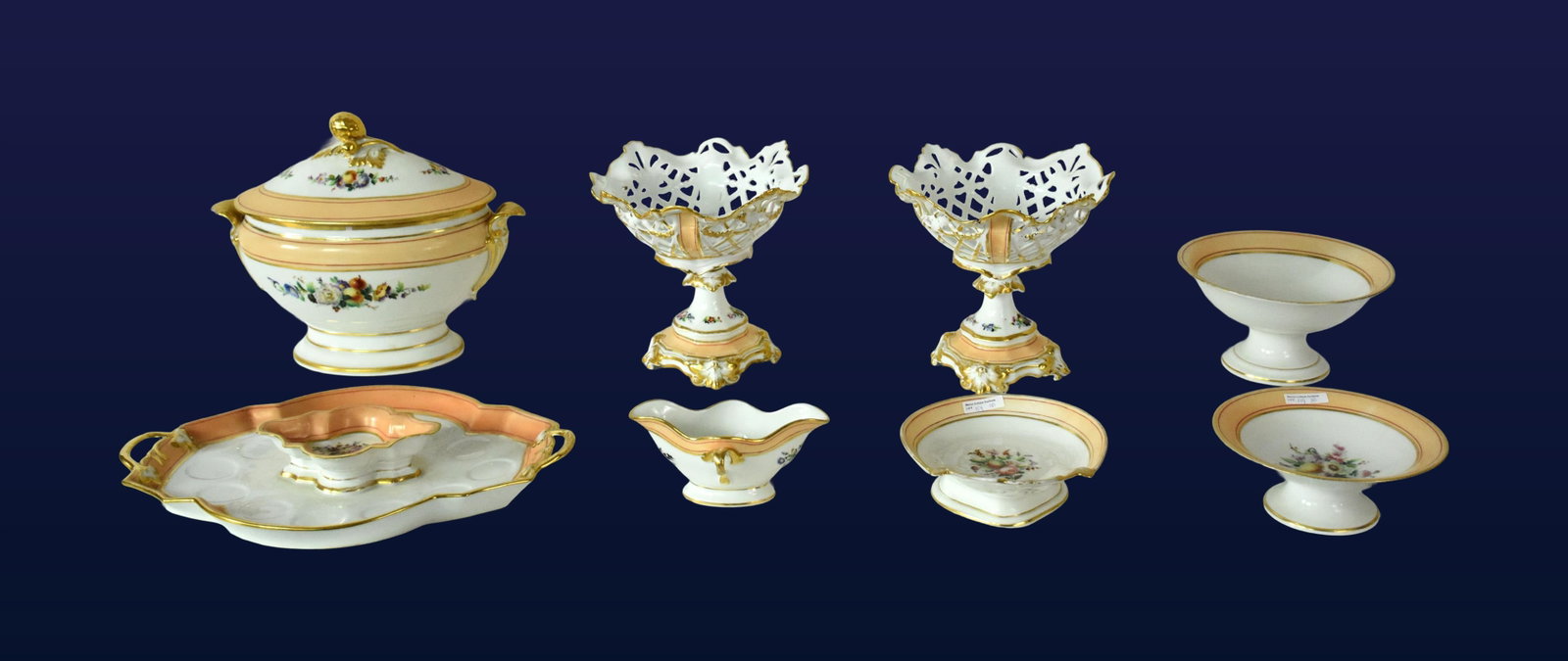 (8) Piece Paris Porcelain Serving Group: 19th C. Decorated with peach borders, gilt rims and accents, hand-painted floral and fruit sprays. Unmarked. To include: (A) Covered handled tureen. 12" high with lid x 15" wide x 7 1/2" wide. (B)