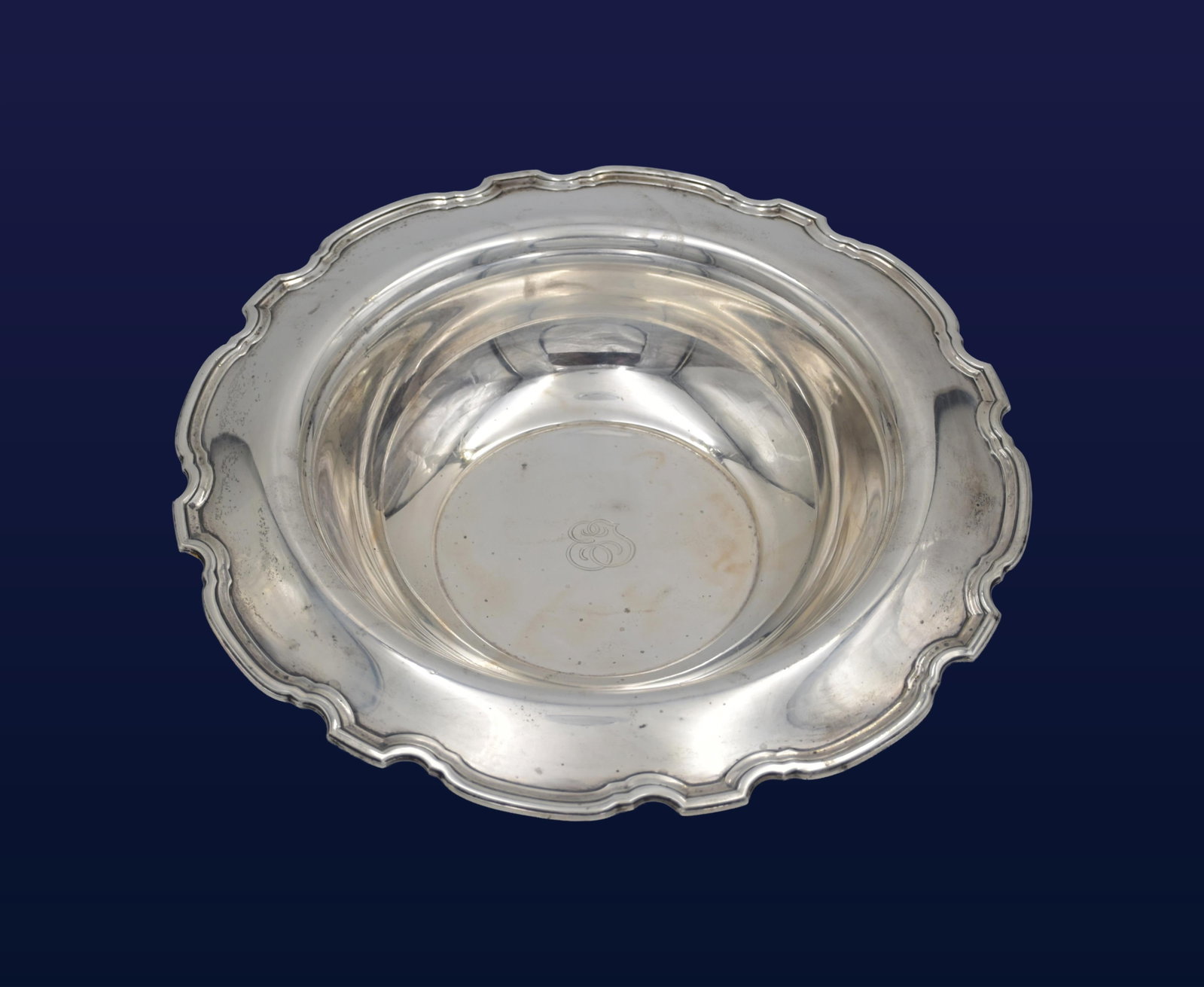Tiffany & Co. Sterling Silver Bowl: 20th C. Hampton Pattern. Flared scalloped rim. Marked "Tiffany & Co. Makers, Sterling Silver 925-1000". 11 3/4" diameter x 2 1/4" high. 25.44 ozt.Condition consistent with age and use. Monogrammed.