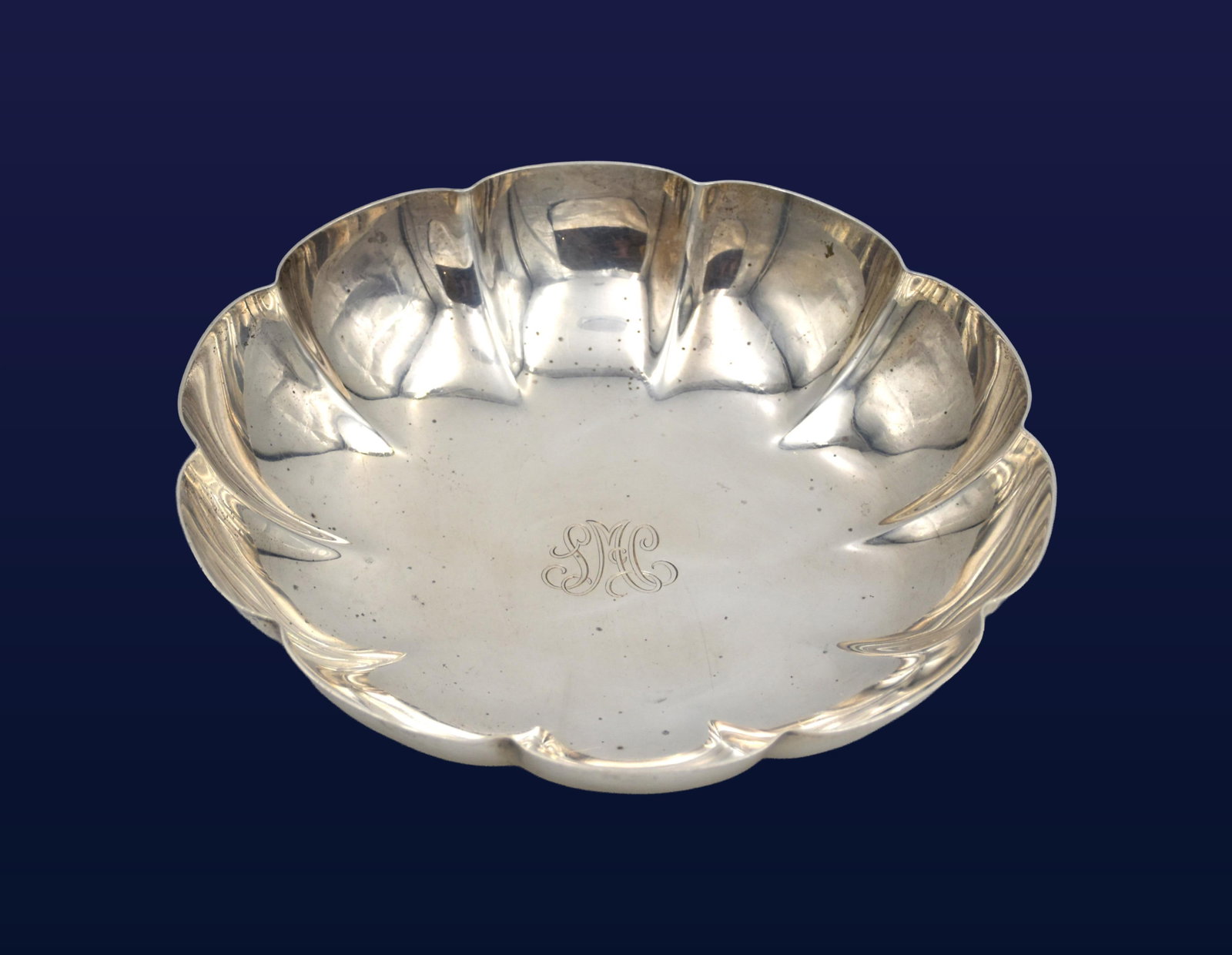 Tiffany & Co. Sterling Silver Bowl: 20th C. Scalloped border. Marked "Tiffany & Co. Makers, Sterling Silver" . 8 1/2" diameter x 2" high. 14.65 ozt.Condition consistent with age and use. Monogrammed. IMPORTANT- Please note: all items