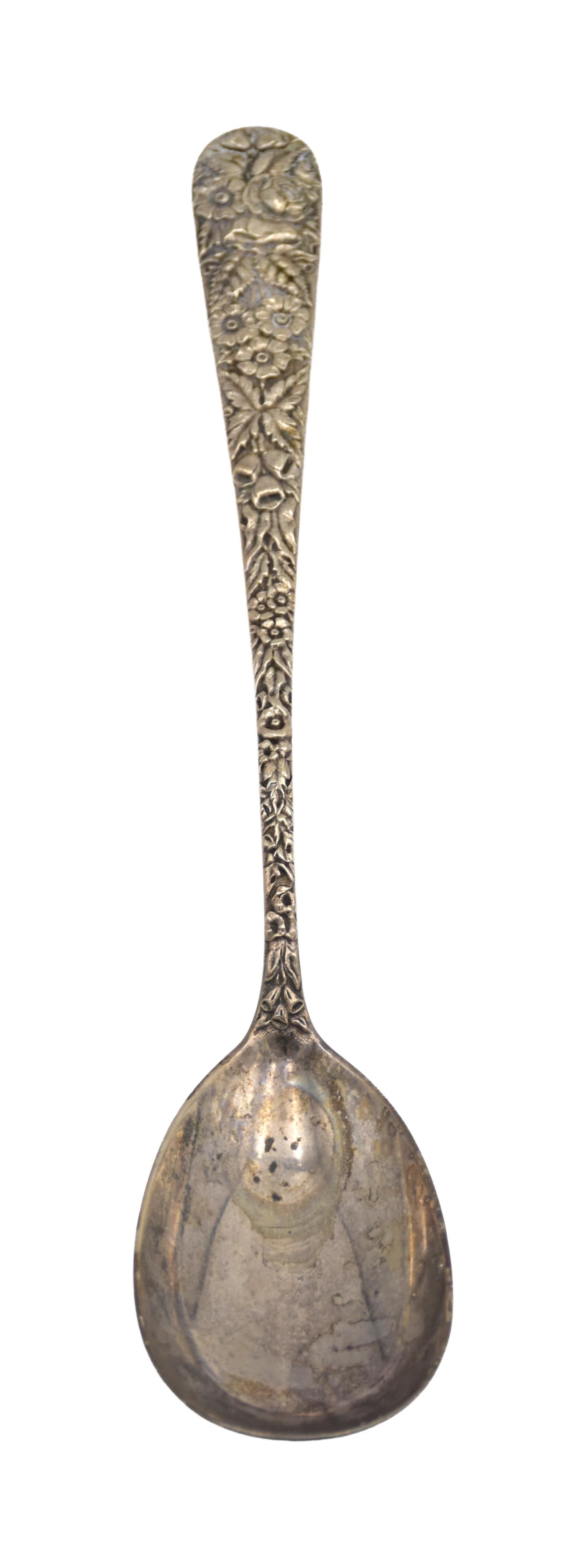 S. Kirk & Son Large Serving Spoon: 20th C. Repousse design. 12" long. 4.90 ozt.Monogrammed on verso. IMPORTANT- Please note: all items are sold as is, where is, with all faults. Marion Antique Auctions encourages all bidders to