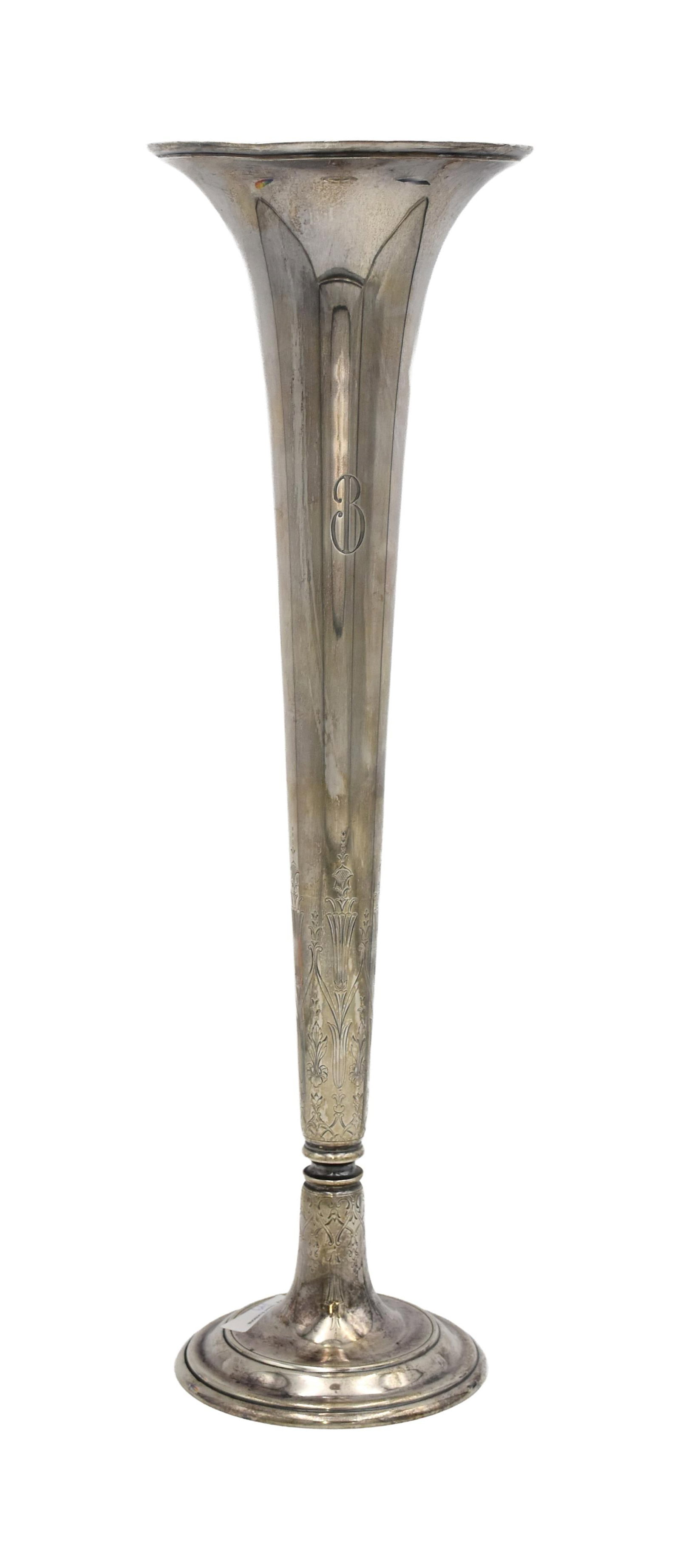 Tiffany & Co. Sterling Silver Trumpet Vase: Ca. 1920. Engraved Art Deco design. Stamped "Tiffany & Co. 19821. D. Makers #4955. Sterling Silver 925-1000. M". 20" high x 6" diameter at top. 30.39 ozt. Provenance: Estate of Alfred J. Walker,
