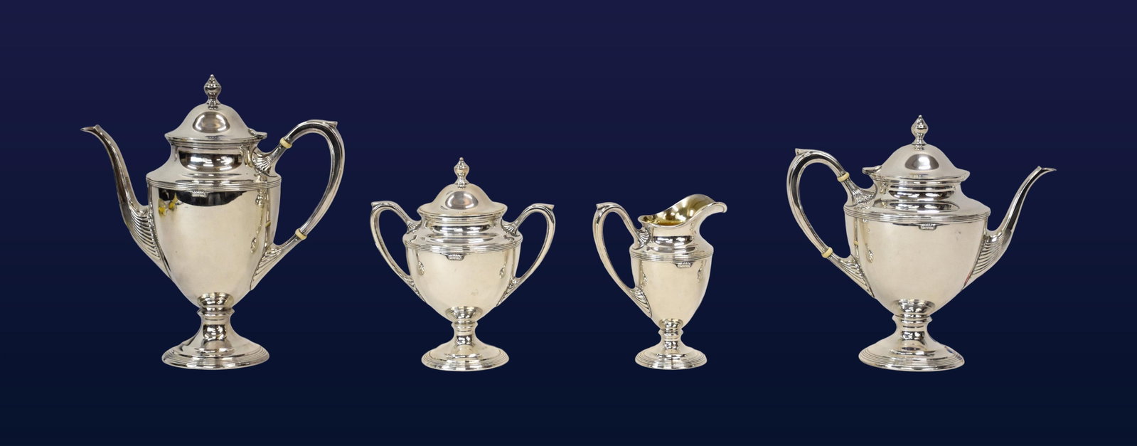 (4) Piece Sterling Silver Tea Service: Early 20th C. Unknown maker. Stamped sterling on bottoms. To include: (A) Coffee pot. Hinged dome cover with urn finial. Two bone insulators. 11 1/2" high x 10" wide from spout to handle x 4" diameter