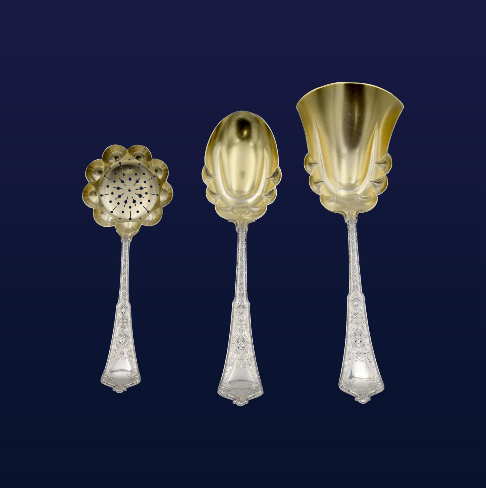 (3) Tiffany Sterling and Gilded Serving Pieces: Late 19th C. Persian pattern. Stamped "Tiffany & Co. Sterling Pat. 1872" on handles. To include: (A) Berry scoop. 9 1/2" long. (B) Sugar sifter. 7 1/4" long. (C) Berry/casserole spoon. 9" long. 7.70