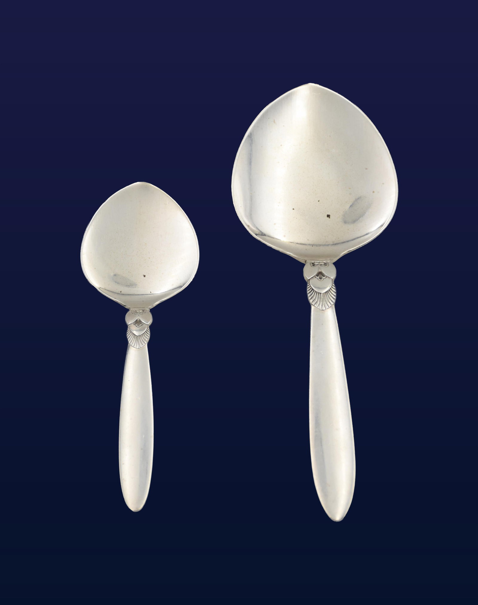 (2) Georg Jensen Sterling Silver Pastry Servers: 20th C. Cactus pattern. Larger: 7 3/4" long x 2 3/4" wide at widest serving point; Smaller: 5 3/4" long x 1 3/4" wide at widest serving point. 3.77 total ozt.Good condition consistent with age and