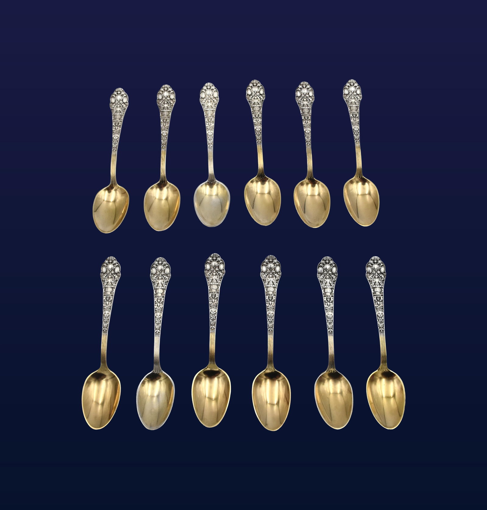(12) Sterling Silver Demitasse Spoons: Late 19th/Early 20th C. Gorham hallmark and sterling stamp on verso. Gilt-washed bowls. Ornate figural relief handles. 4 1/4" long. 4.54 total ozt. Some show loss to gilt. Three spoons are
