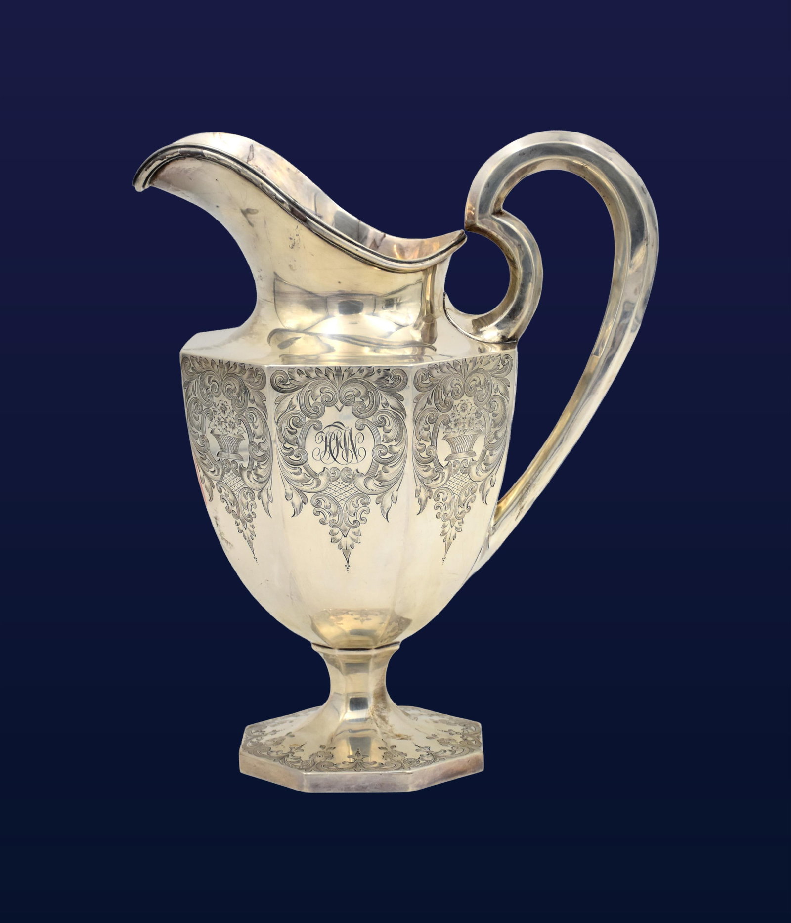 Sterling Silver Pitcher: Early 20th C. Foliate engraved design. Stamped "Sterling". Unknown maker. "3 1/2 pints and 71/D on bottom". 10 3/4" high x 8 1/2" wide from handle to edge of spout. 29.38 ozt. Monogrammed. Good condit