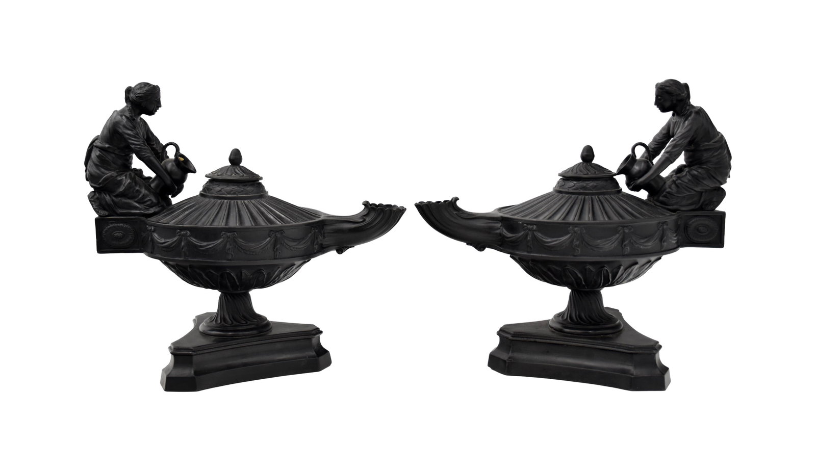 Pair of Wedgwood Basalt Lamps: 19th C. Figural handles. Signed "Wood & Bentley Etruria" on base. 9" high x 10" wide x 5" deep. Exhibition sticker "Jubilee Exposition, Josiah Wedgwood". Old Skinner auction tag. Provenance: Estate