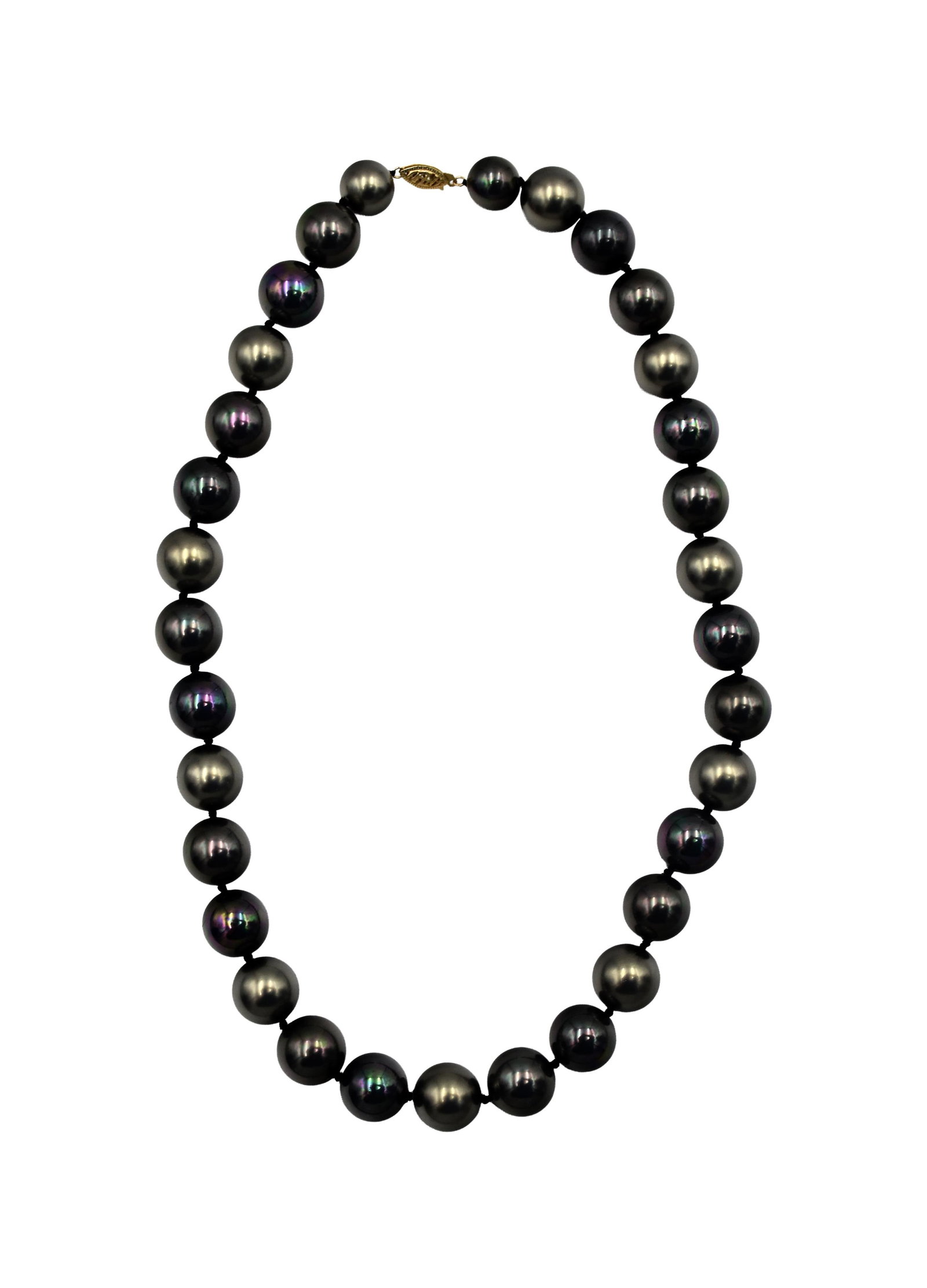 Tahitian Blue-Black Pearl Necklace: 14kt gold clasp. Luminous pearls of varying colors; some have more blue-purple undertones and others have silver undertones. Thirty-three pearls at 14.1 mm each. Two pearls closest to the clasp are 11