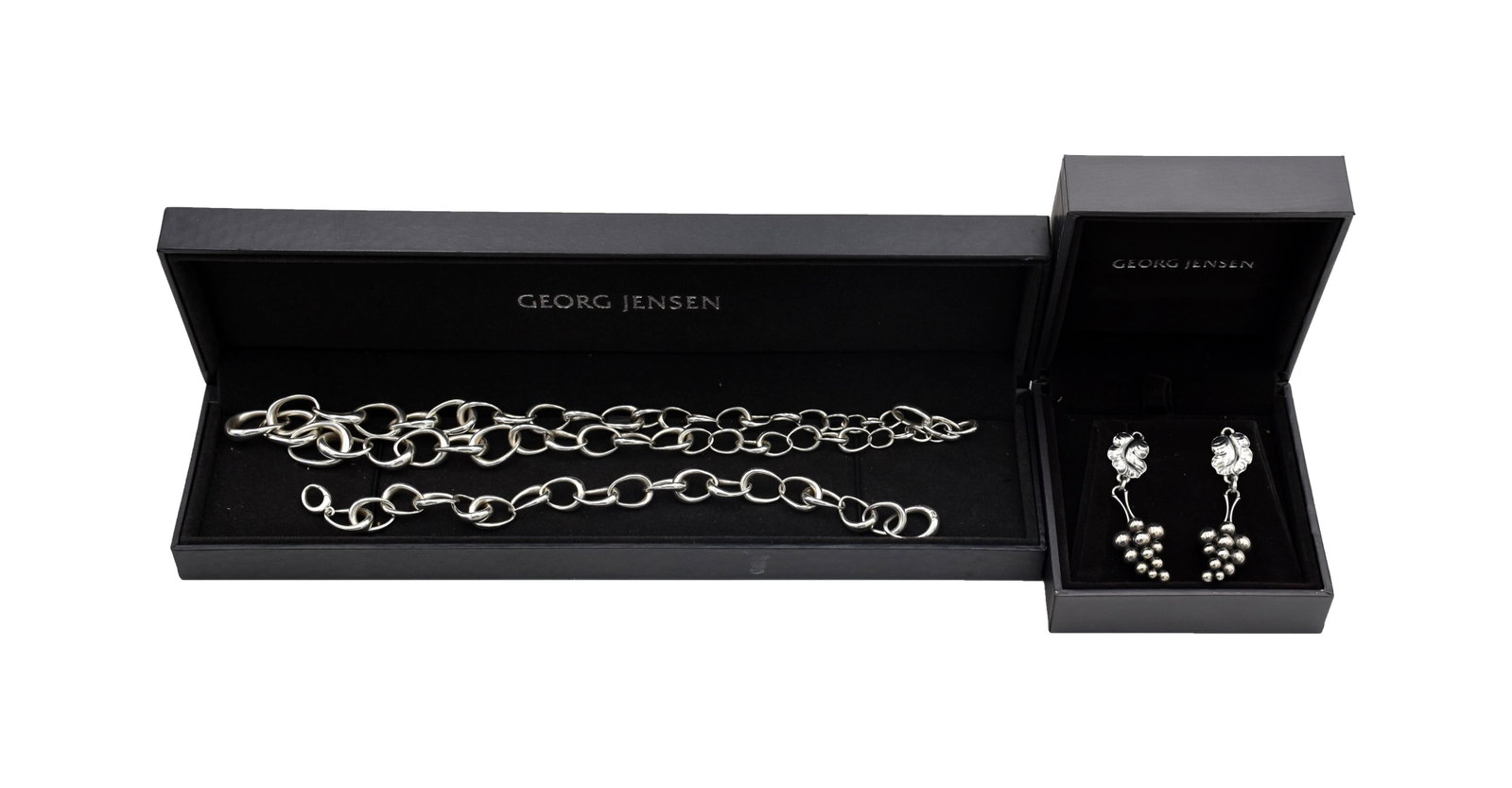 (3) Piece Georg Jensen Jewelry Set: 20th C. Sterling silver. To include: (A) Pierced earrings. Moonlight Grapes design. 2". (B) Offspring design bracelet. 8" long. . 76 ozt. (C) Matching offspring necklace. 18" long. 1. 62 ozt. Good